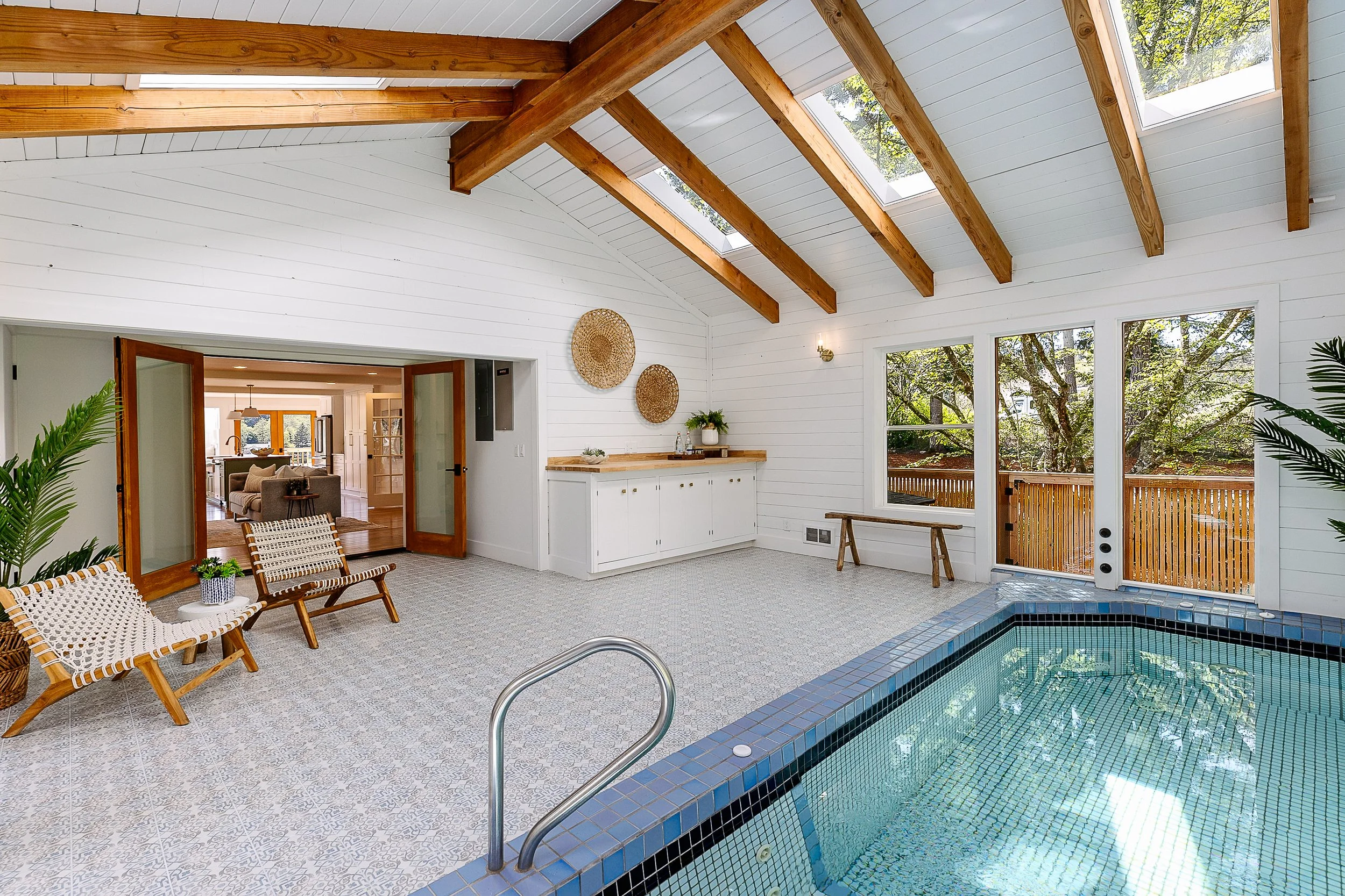  An indoor pool is a “cherry on top” of this enchanting home, say Dariia and Mike Bicer, who gave the property a complete overhaul. The couple started Bainbridge Custom Homes after relocating to the island from the East Coast in 2021. 