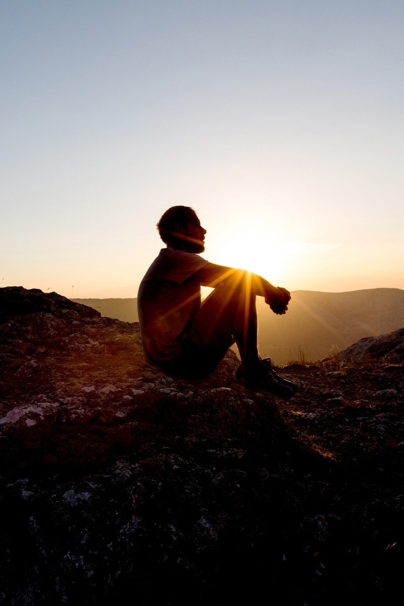A man resting during a hike