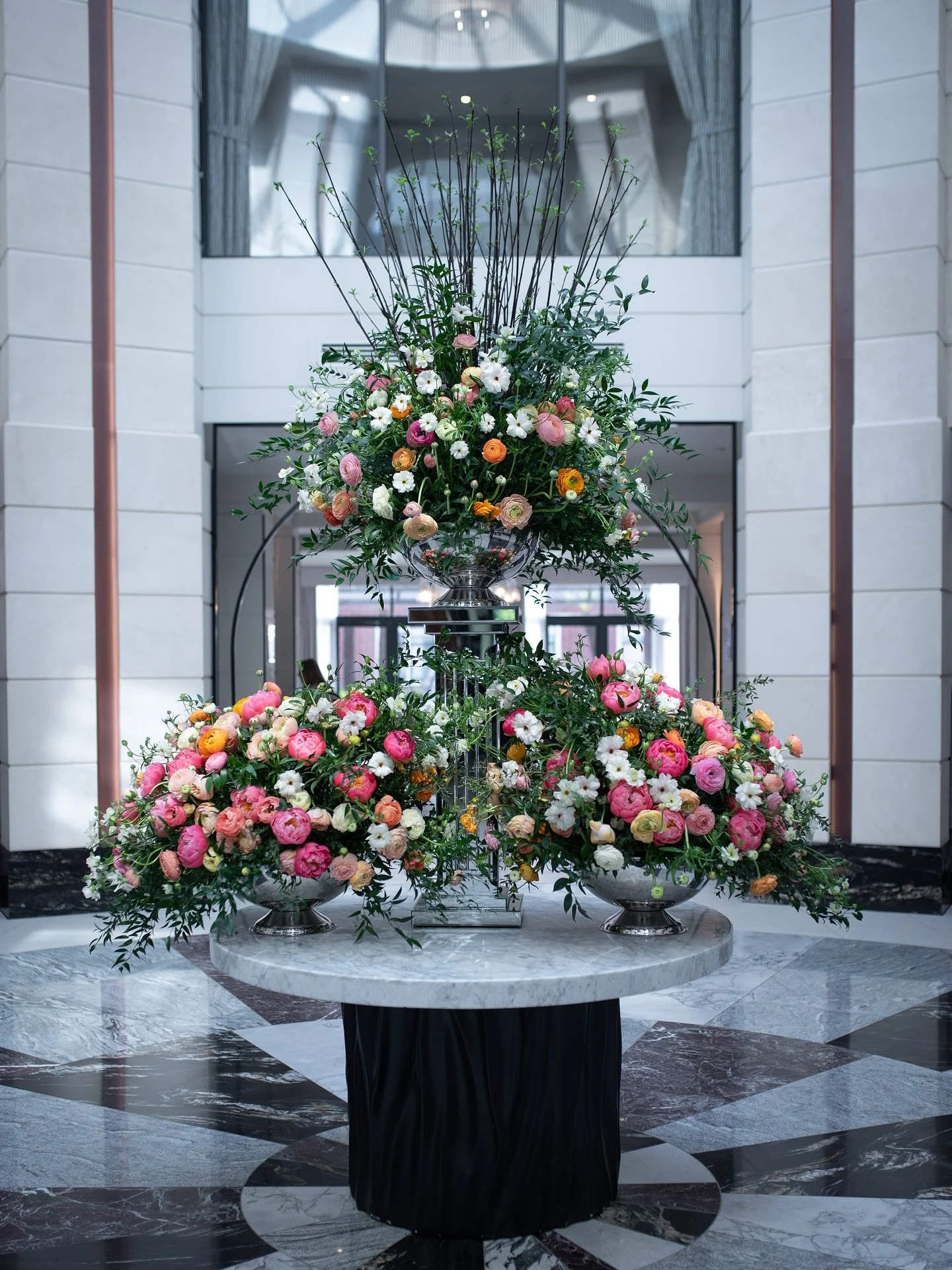 Each week, we have fun reimagining our lobby arrangements by choosing flowers that not only complement the space, but also bring a fresh burst of color and energy for our guests to enjoy. From bold seasonal blooms to soft, fragrant accents, no two we