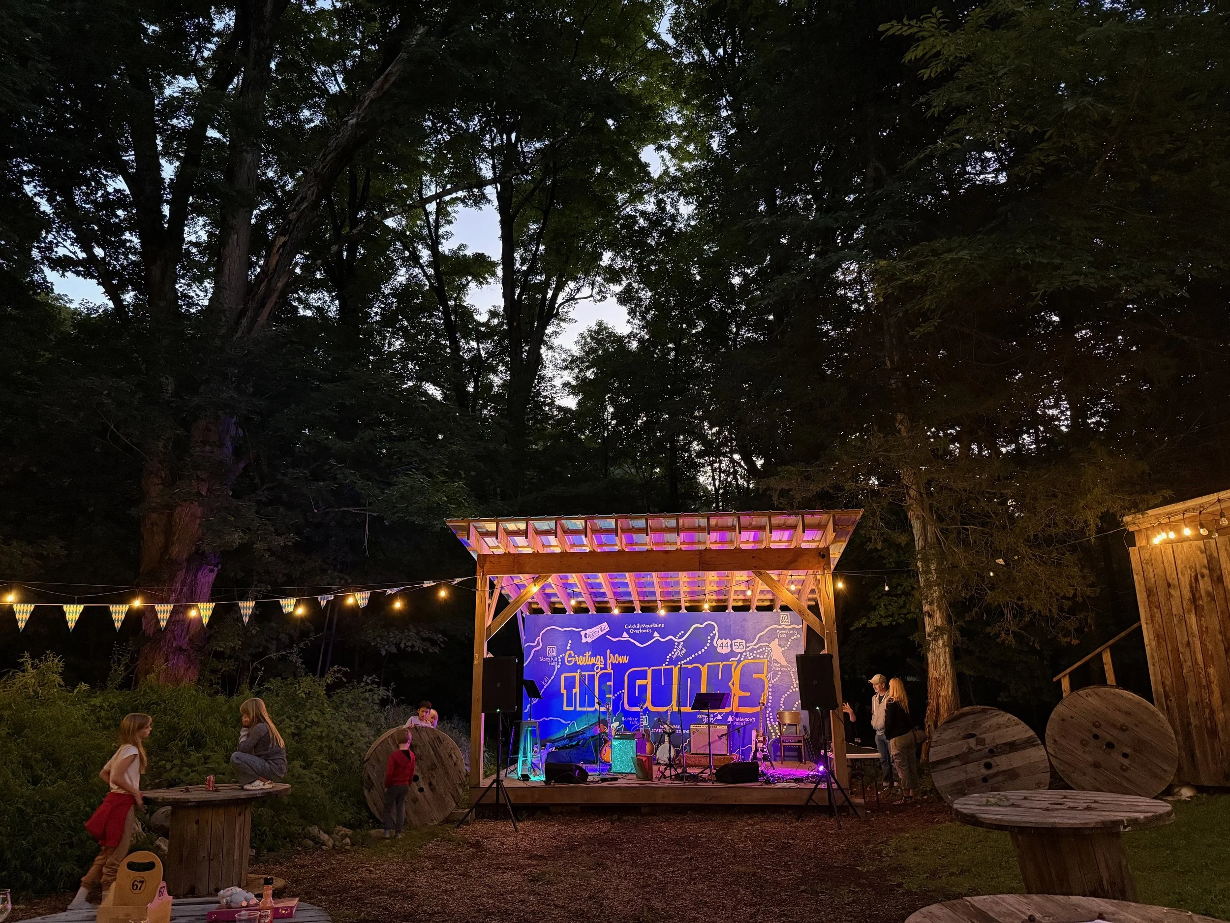 Rough Cut Brewery's backyard stage with a mural of The Gunks