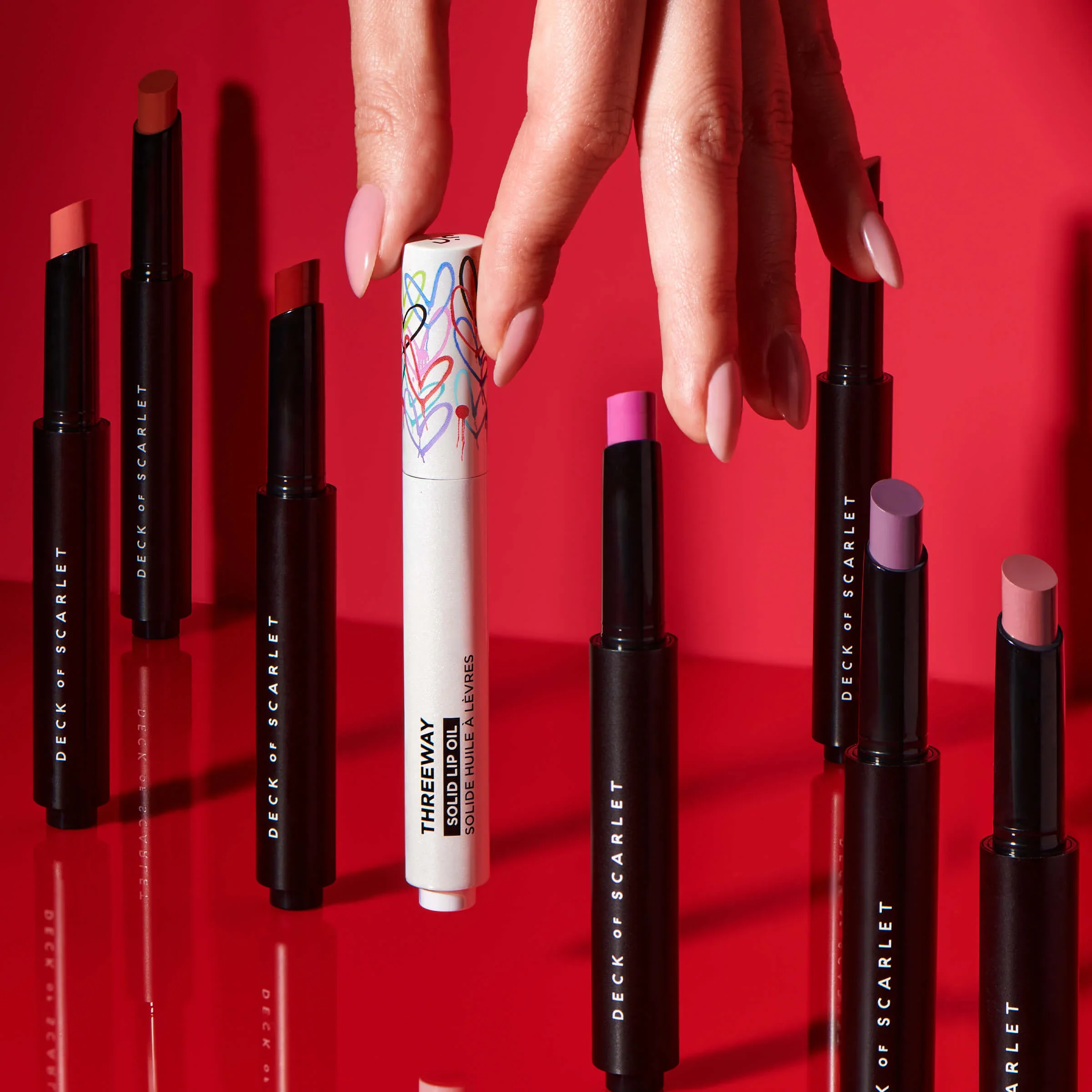 Threeway Solid Lip Oil: Buff Rose, Purple Reign, Mauve Minx, Rose Goddess, Cocoa Spice, Nude Ambition, Merlot Moves, Bordeaux Baby, Scarlet Passion, Peach Sands, Fuchsia Shock, Orange Rave, Guava Sunrise, Orchid Afterglow, Rouge Supreme, Coral Rose, 