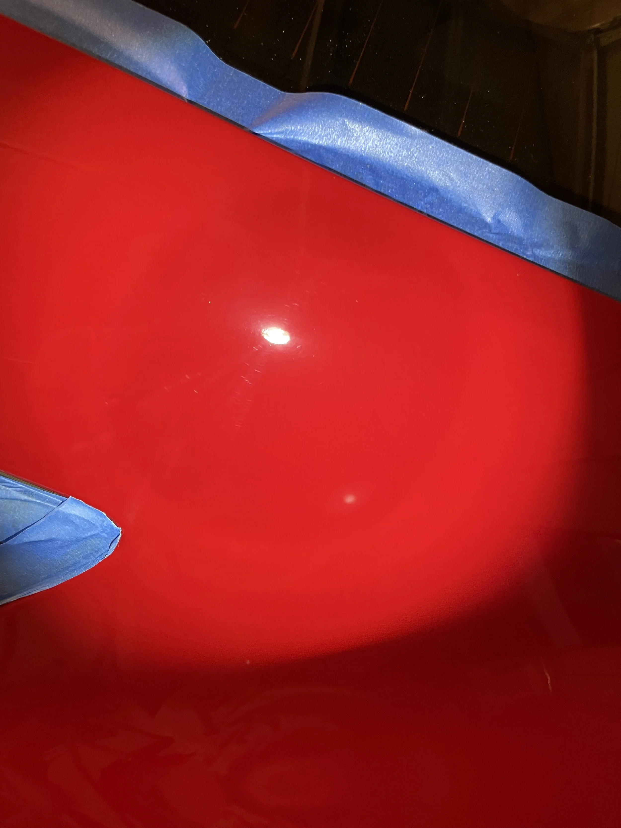 Red FR-S paint after correction, showing clearer light reflections and fewer swirl marks.