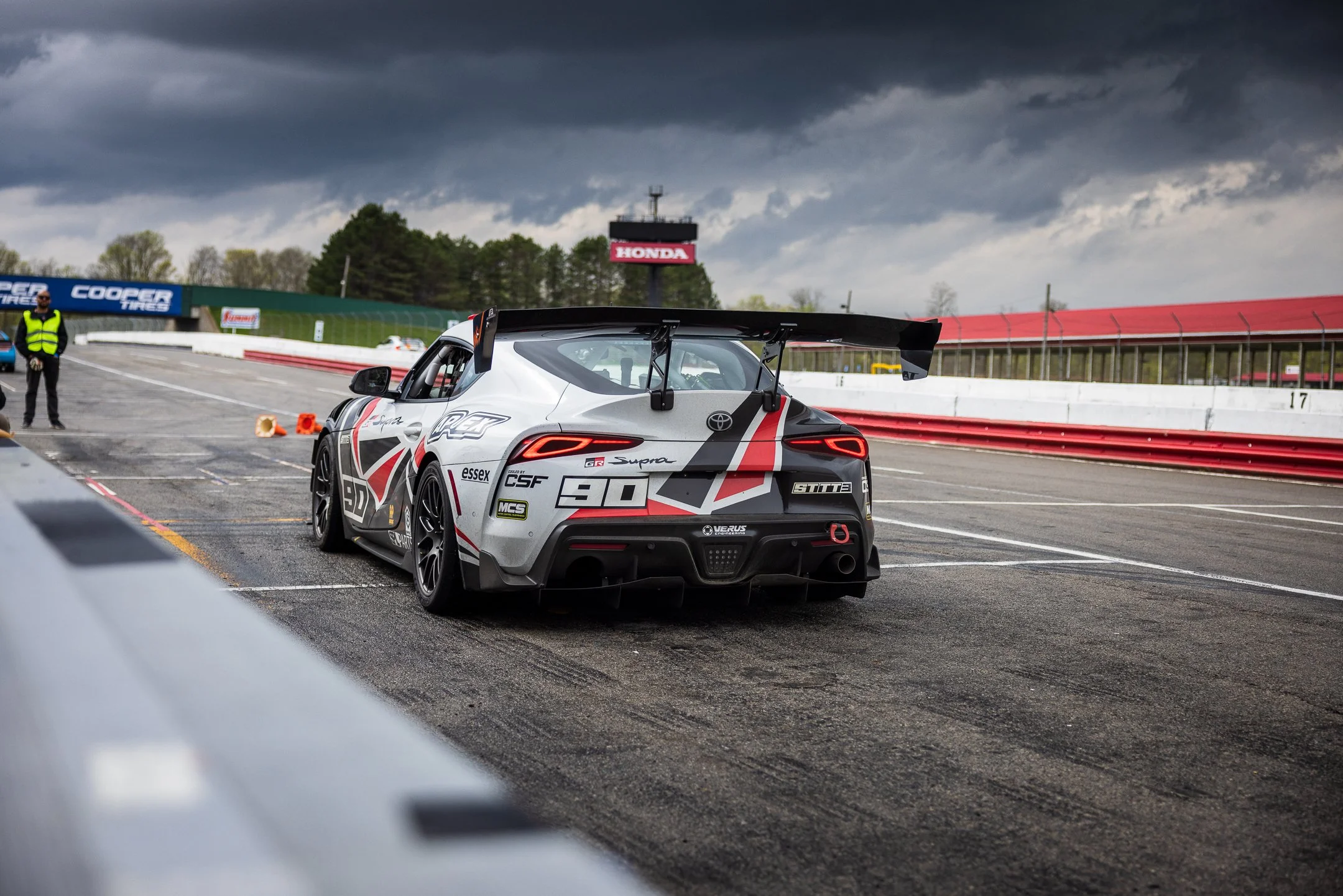 Rear view of Toyota R&D Racing’s number 90 A90 Supra in pit lane at Mid-Ohio Sports Car Course.