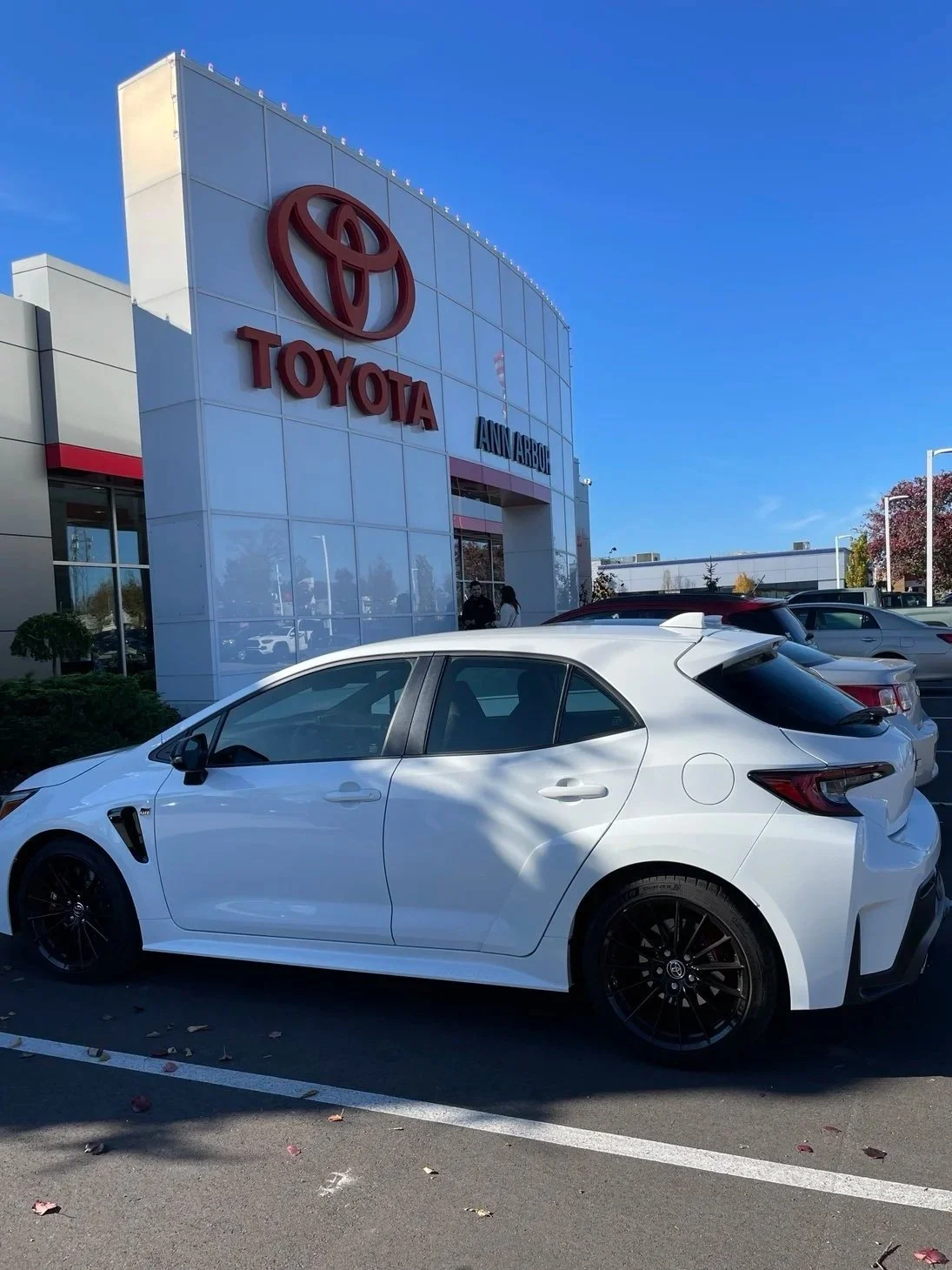 Ice Cap White 2024 Toyota GR Corolla Core parked outside Toyota of Ann Arbor at pickup.