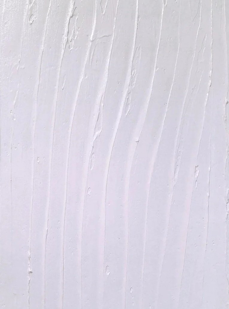 Close-up of a white scented painting with visible paint strokes and texture.