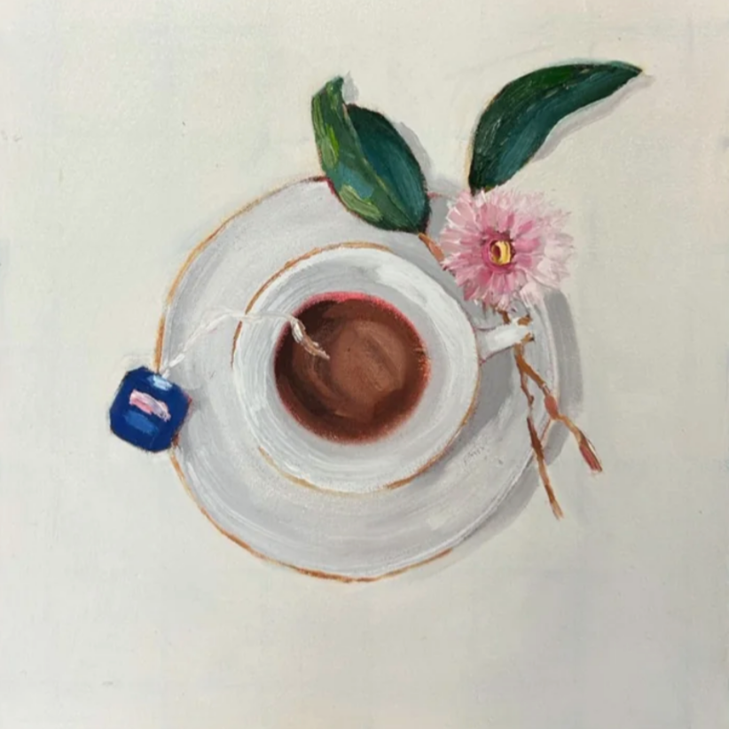 A painted top-down view of a white teacup filled with tea, on a white saucer, with a pink eucalyptus flower, green gum leaves, and a small blue bushells teabag nearby.