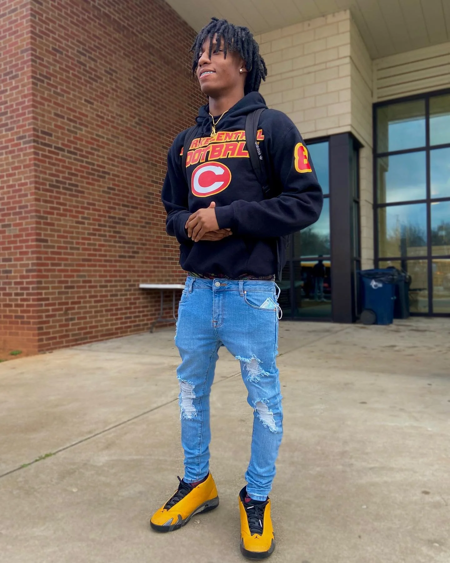 Clarke Central High School senior and varsity football cornerback Frank Manago poses outside by the CCHS bus loop during dismissal after the first day of classes on Jan 6. Manago feels optimistic about the rest of his senior year and is looking forwa