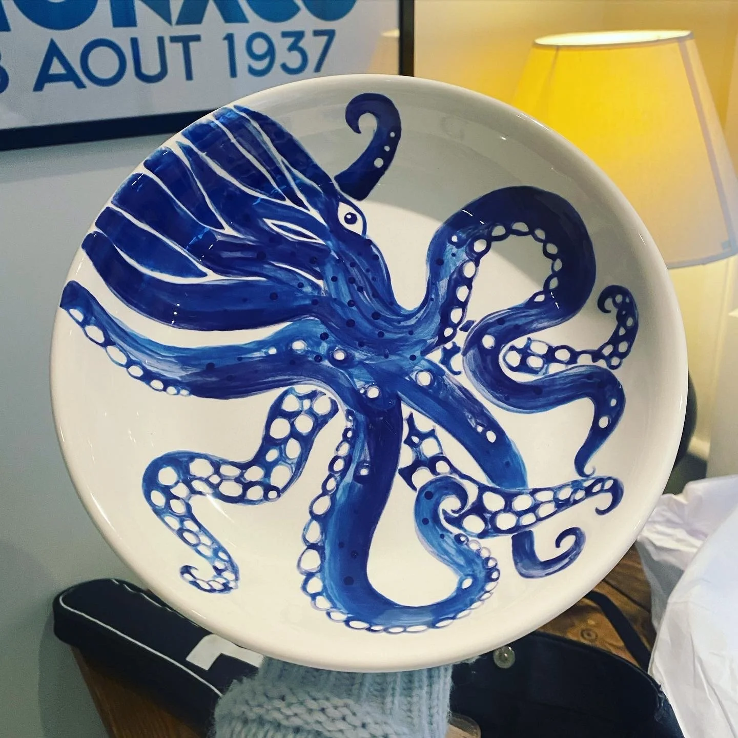 Decorative ceramic plate with a blue octopus design. By Nicole Vanner.