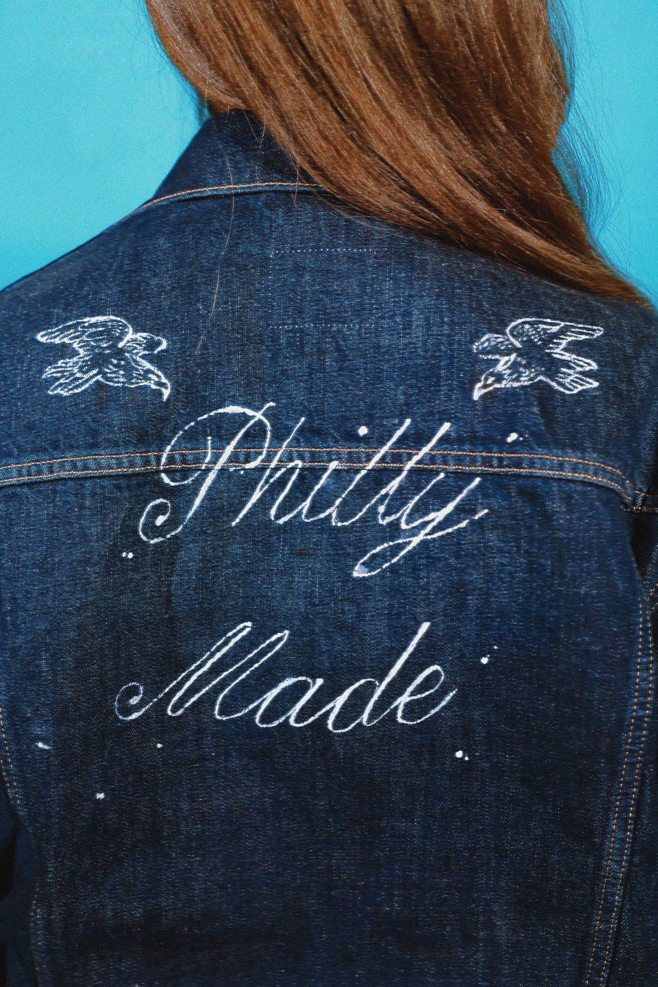 Handpainted white accents embrace the graffiti and art spirit that’s alive in this city, and instantly turn neutral basics into personality pieces