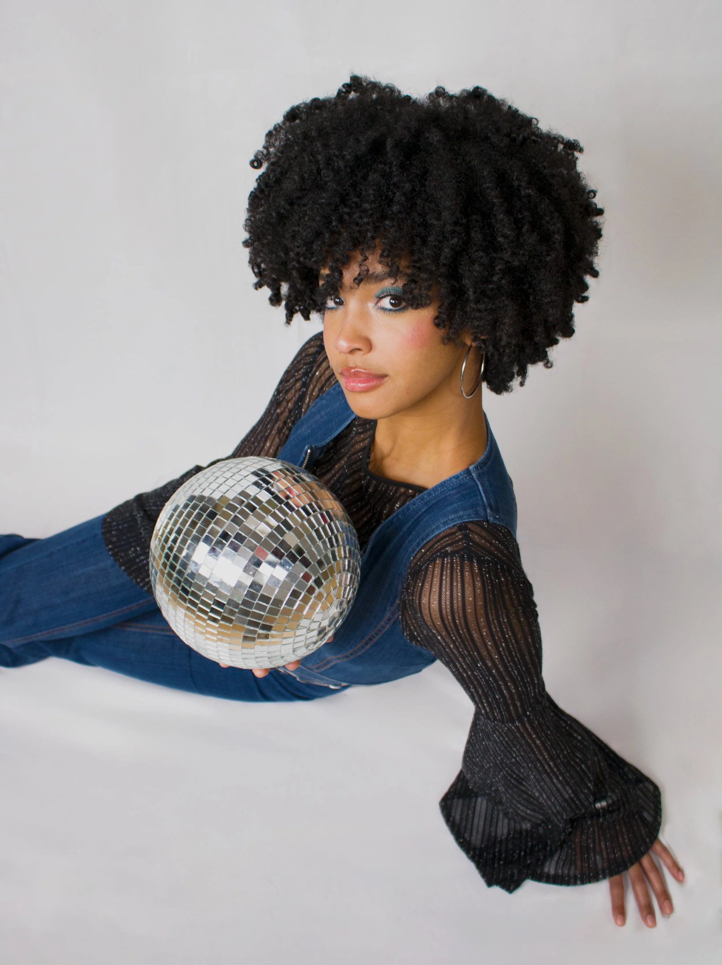 1970s Woman Sitting with Disco Ball Nova Schreiner.jpg