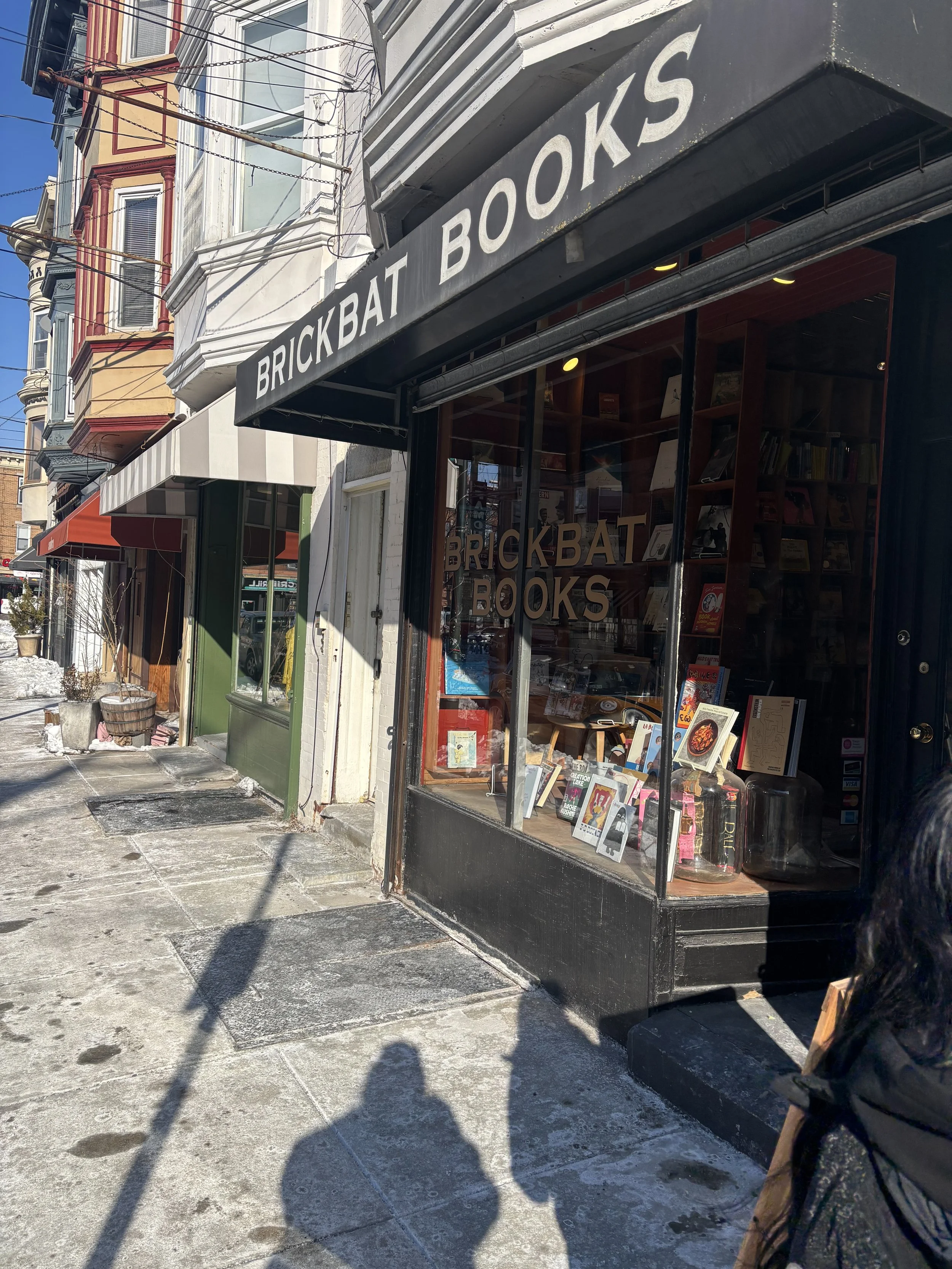 Brickbat Books exterior storefront and window display 