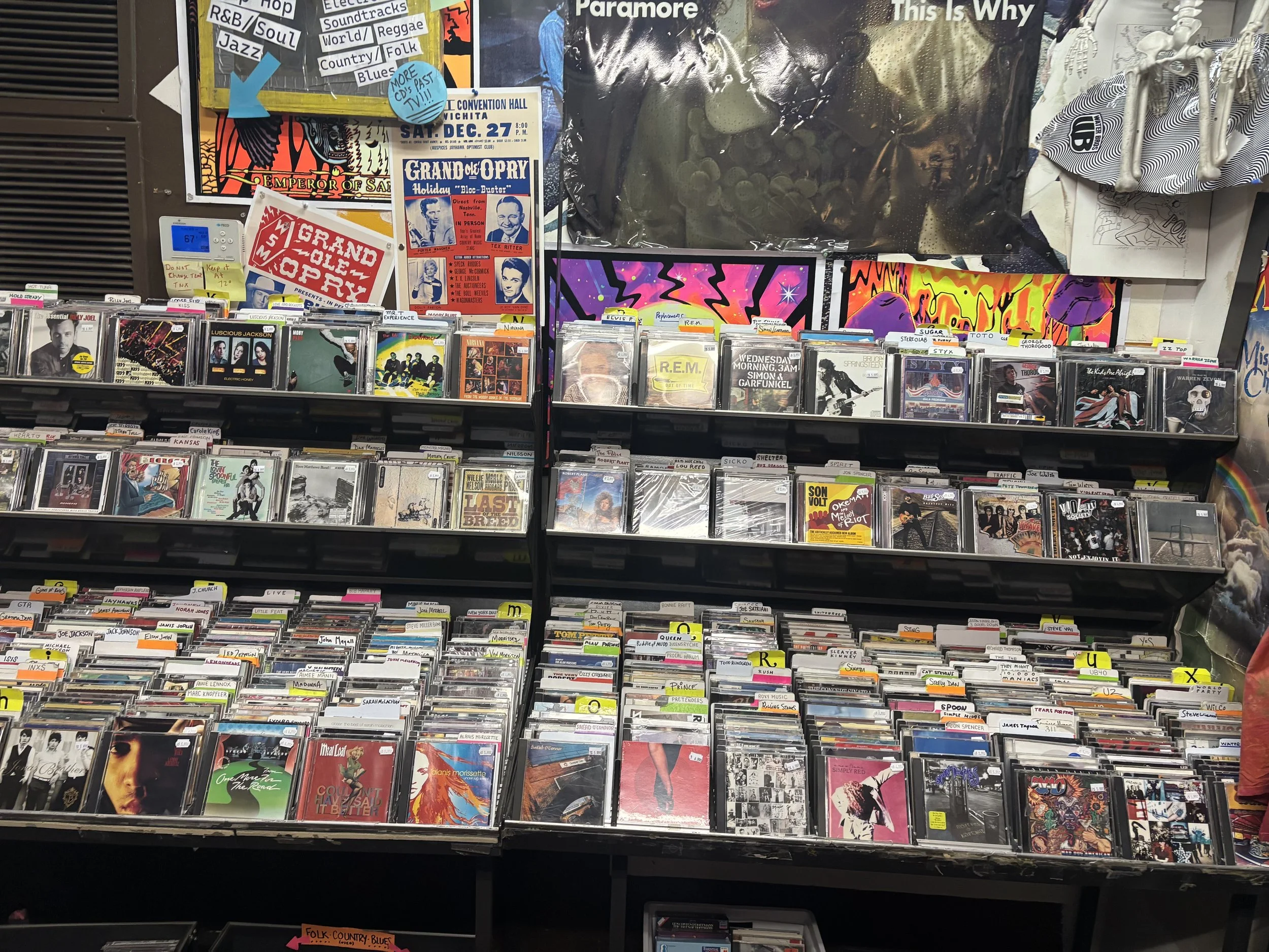 repo Records CD section packed with albums and colorful posters