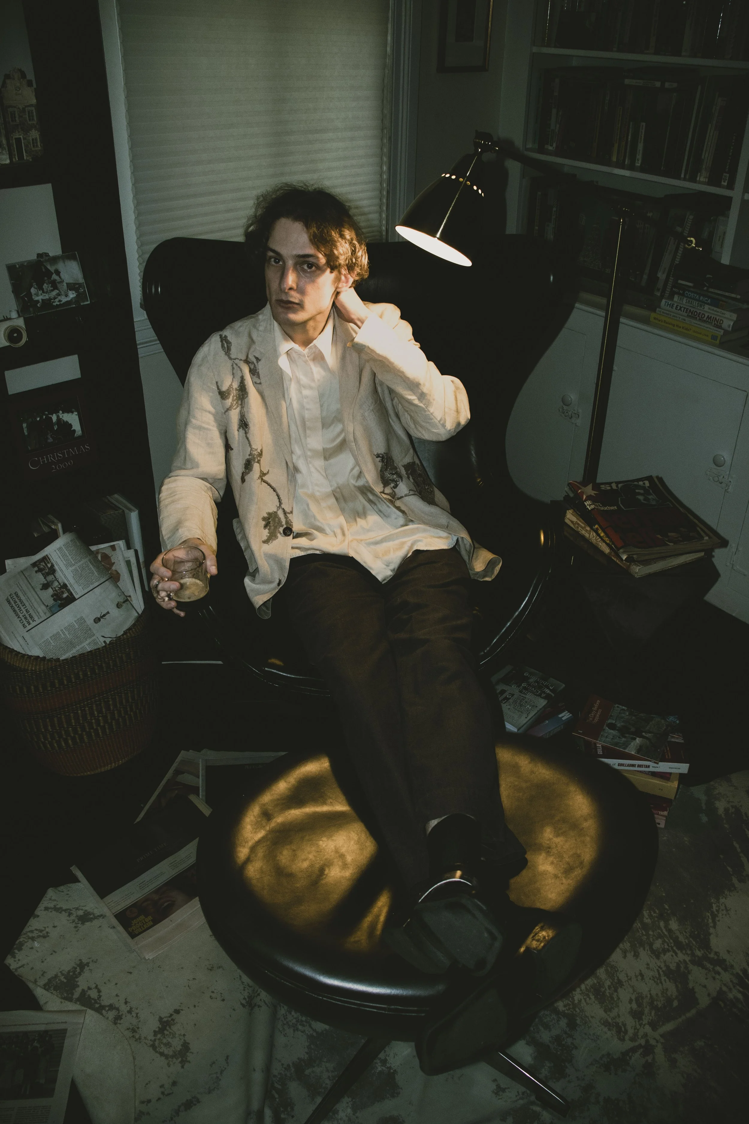 Rentboy's 8 hottest takes sitting in chair with books Emma Detwiler Photographer