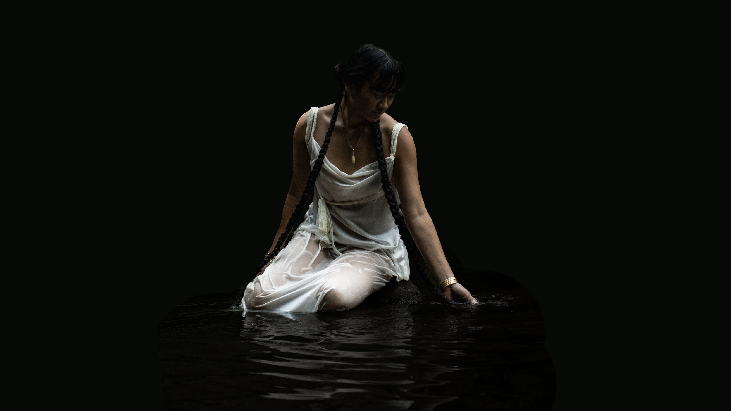 Model in wet silk dress sitting in water - Somaesthetics Emma Detwiler Photographer