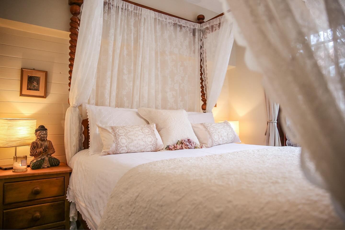 Room 5&rsquo;s stained wood four posted bed is surrounded by fairytale lace drapes. A honeymooner&rsquo;s paradise, this beautiful, airy room has it&rsquo;s own private balcony to watch the doves gather in floral courtyard. It also features a luxury 