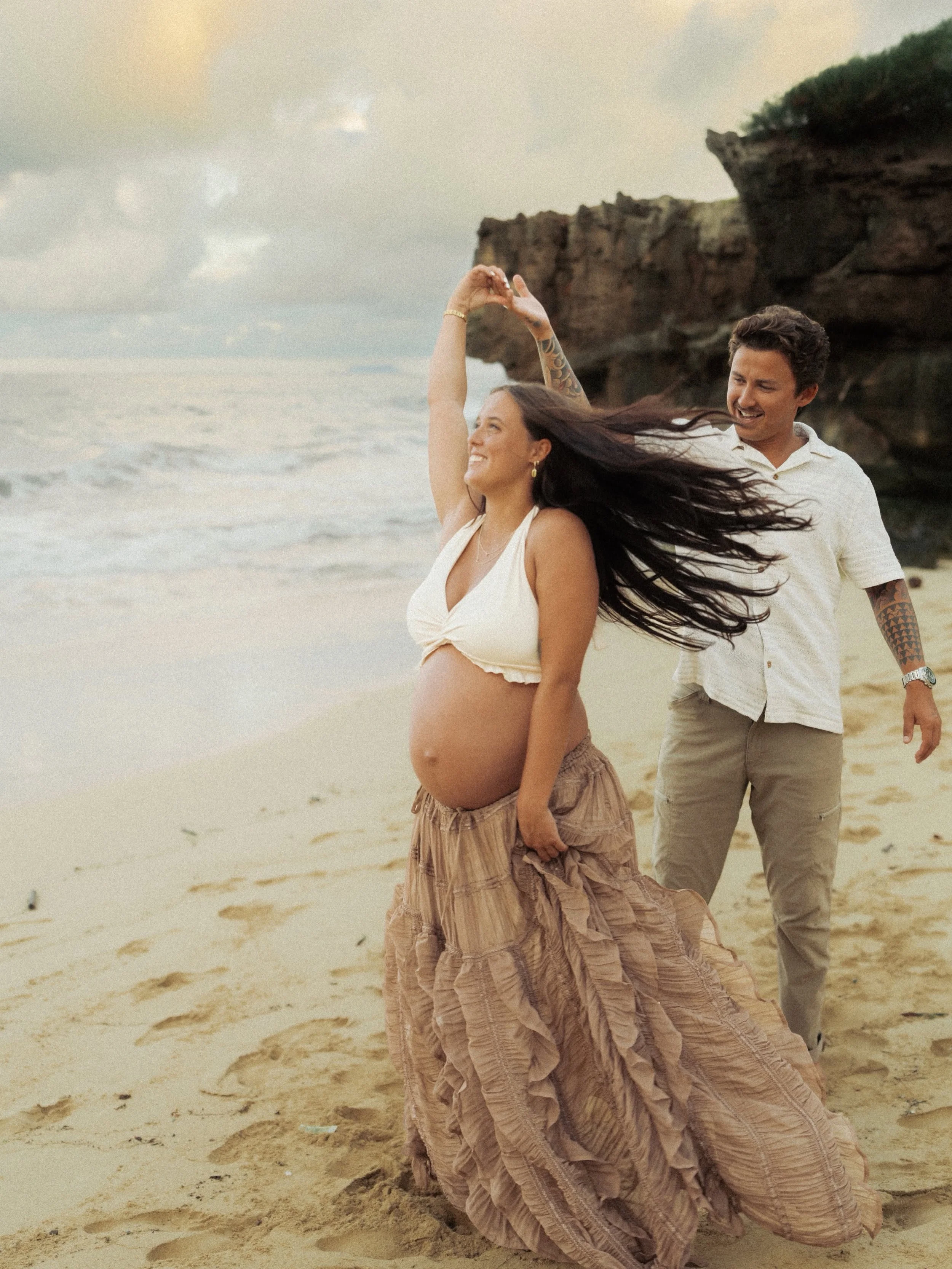 Couples maternity photos session on popular O'ahu beach