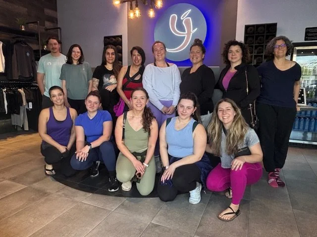 Professionals doing yoga at Yoga Joint in Winter Park.