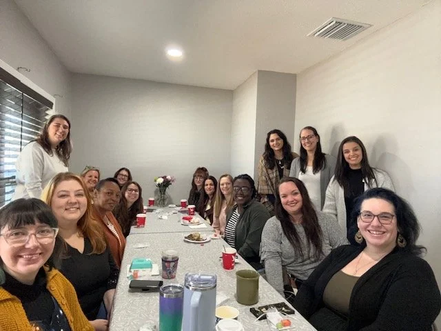 Group of professionals in conference room.