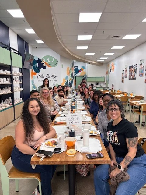 Group of therapists doing pottery.