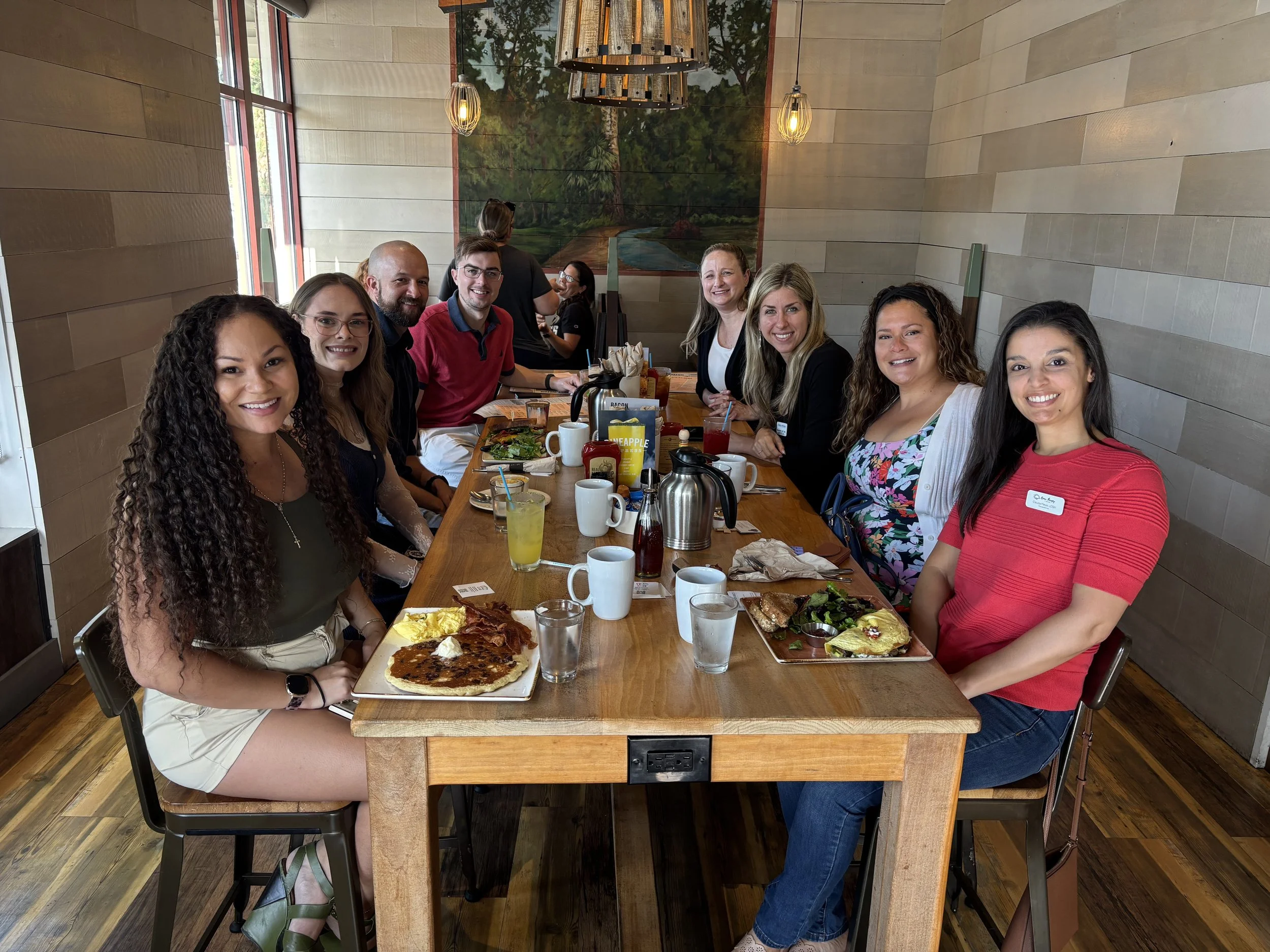 Group eating breakfast at First Watch in Lake Mary.
