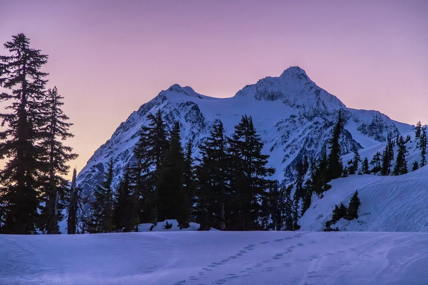The glow of a winter sunrise in the mountains.