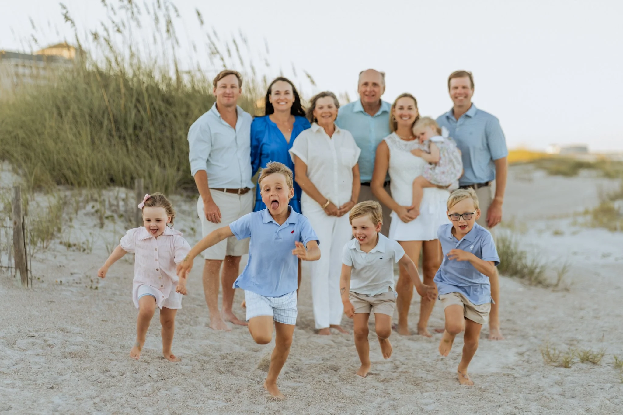 A Family on Amelia Island stands on the Beach at the Omni Amelia Island for a picture. 