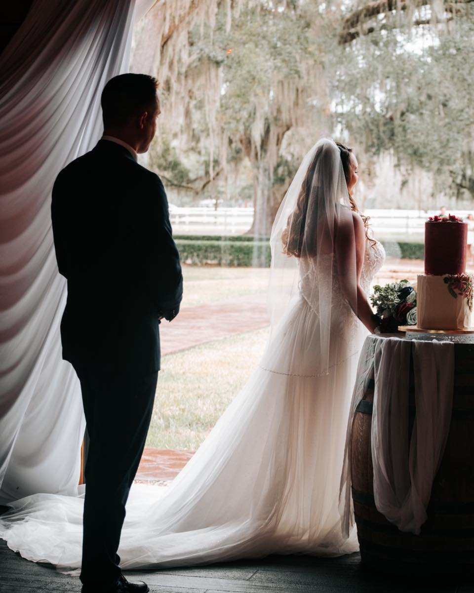 In the quiet before the vows, she looks ahead to their future, with him by her side.  #daresayweddings #WeddingMoments #FirstLook #WeddingPhotography #lookslikefilmweddings