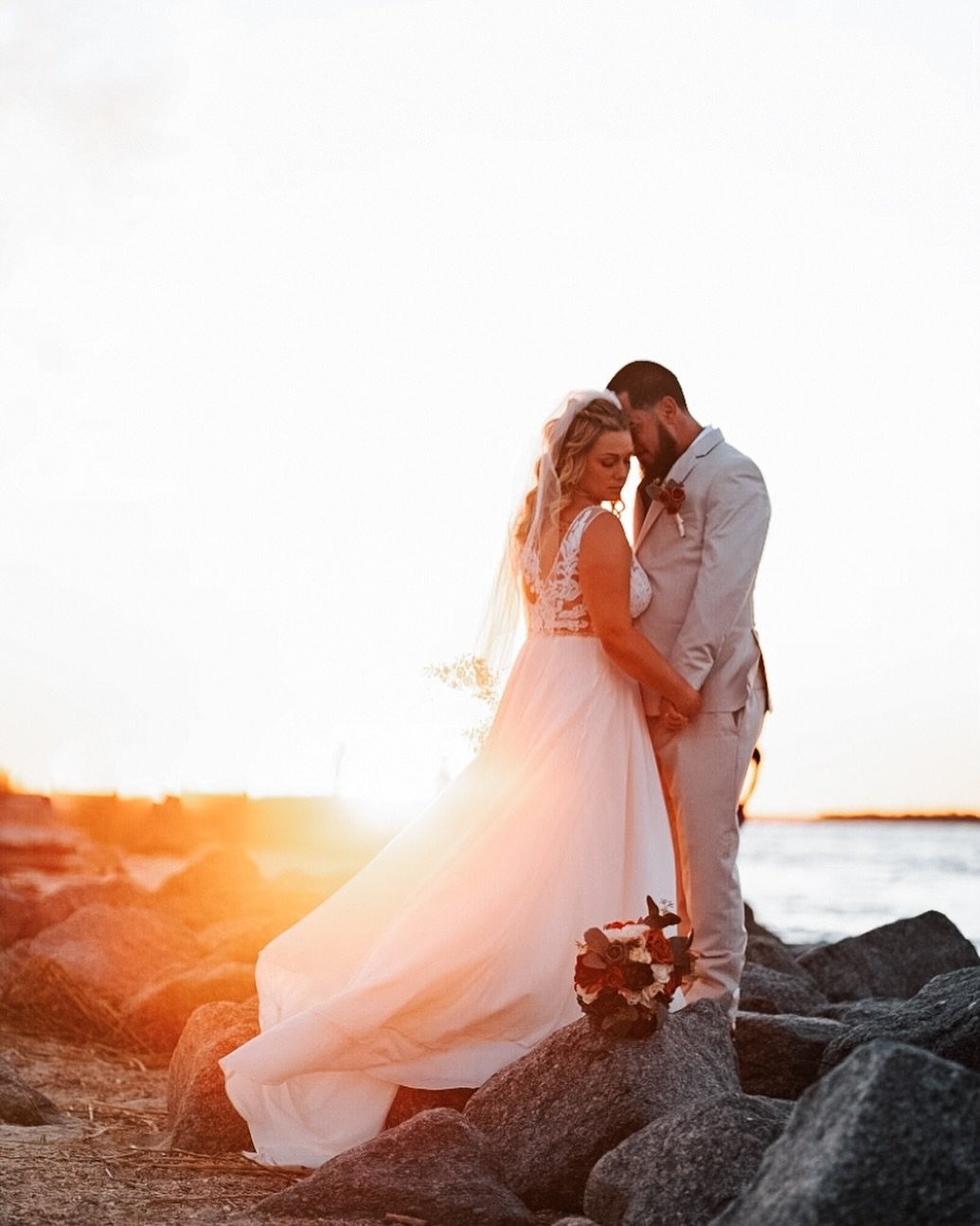Chasing sunsets and photographing love in its most magical light is what it is all about for us! #daresayweddings #weddingphotography #goldenhour #forevermoments #fortclinchstatepark #worldsbestweddingphotos