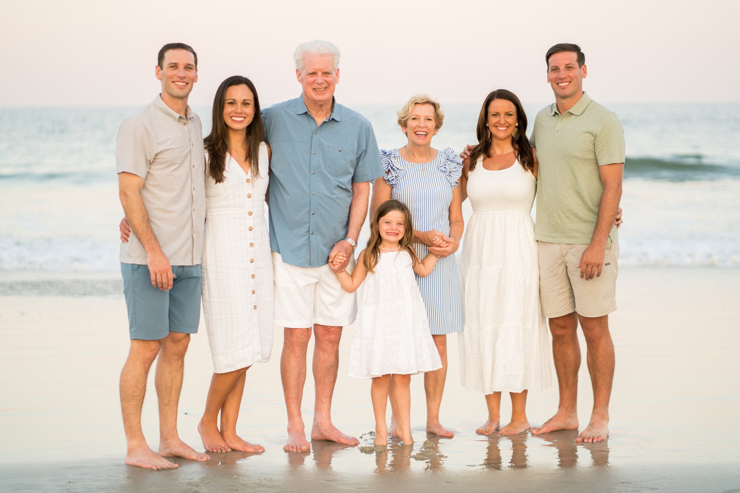 An extended family poses on the beach in Amelia Island at the Ritz Carlton Amelia Island Resort. 