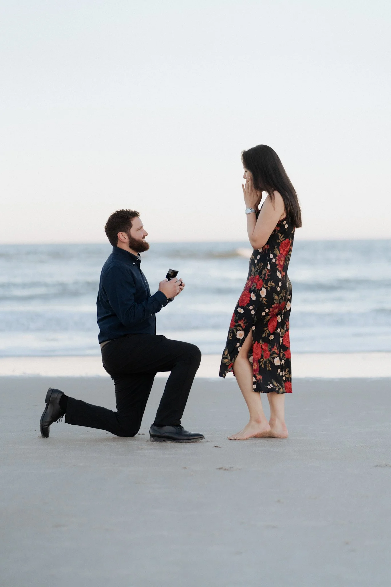 A man surprise proposes to his girlfriend on Amelia Island at The Ritz Carlton Amelia Island.