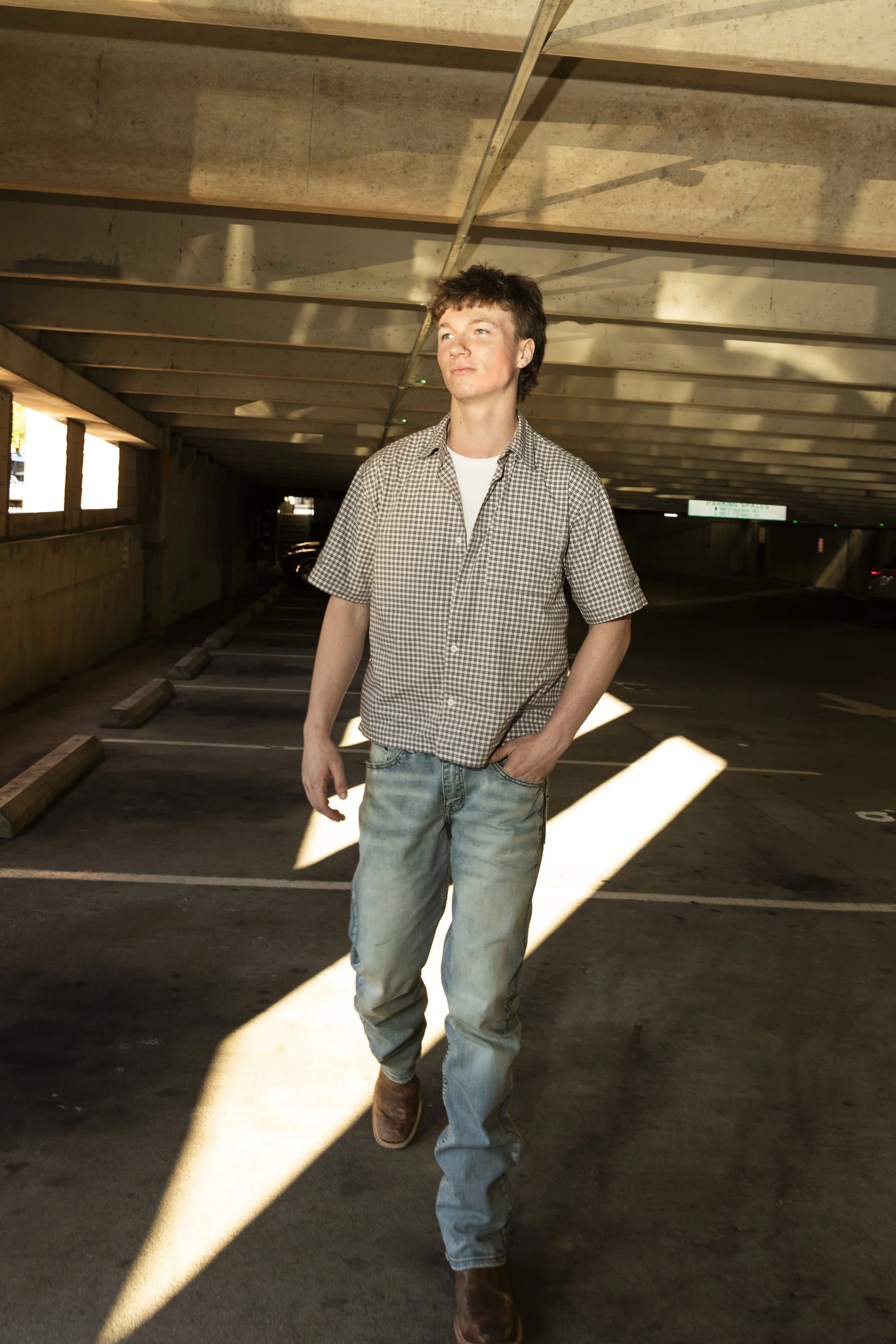 High school senior Sam smiling on Main Street in downtown Franklin, TN