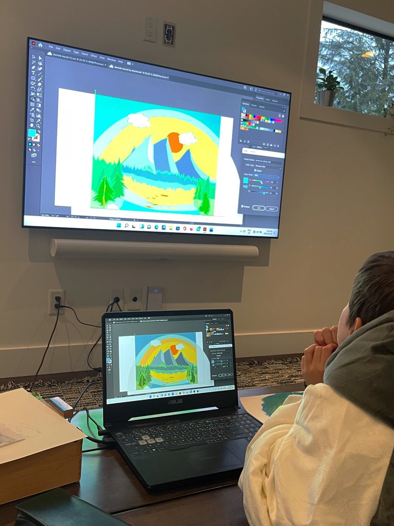 Daniel adjusts the colours to get the exact effect he wants on a digital image of his painting