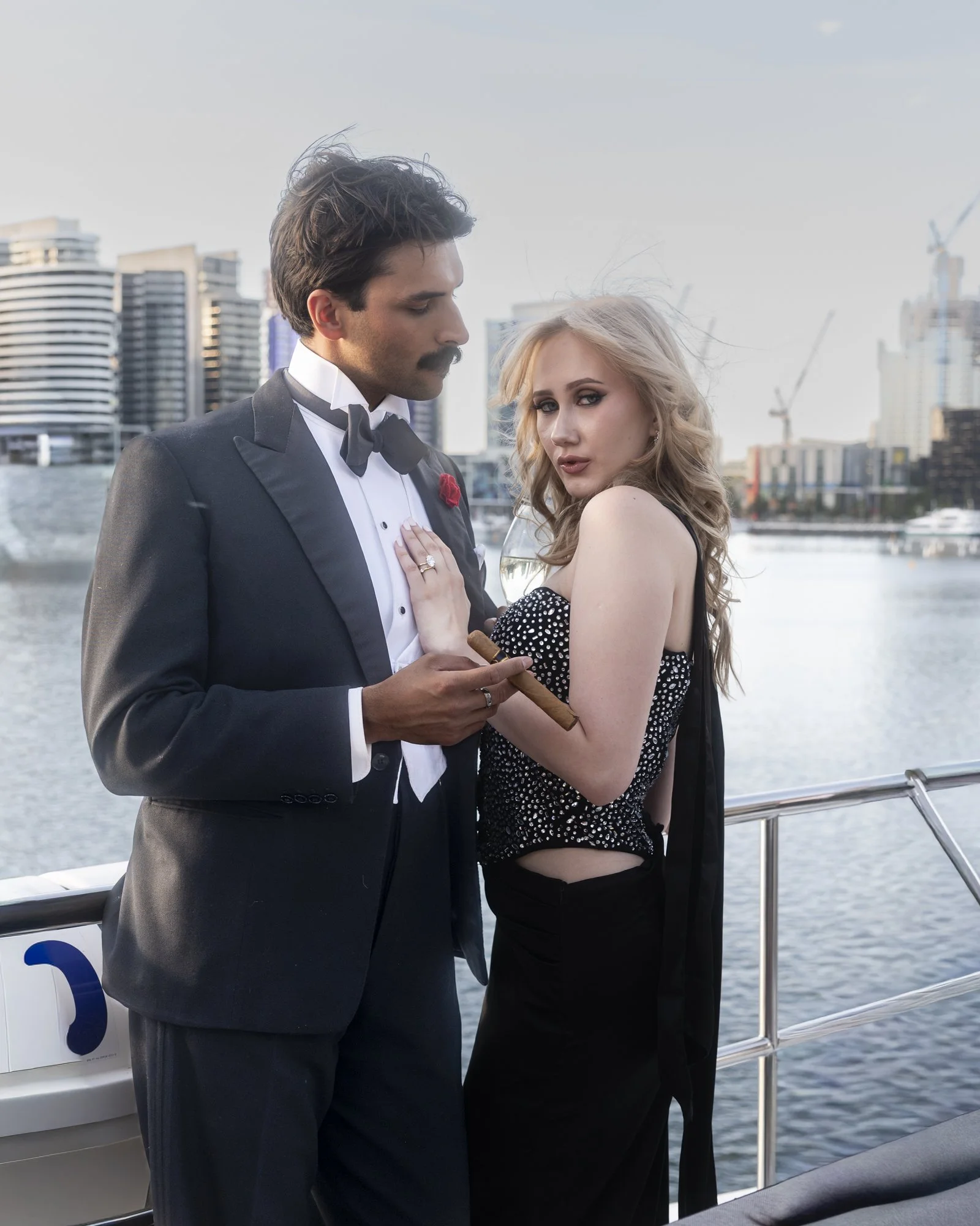 Young couple on a luxury boat in Docklands Harbour, Melbourne