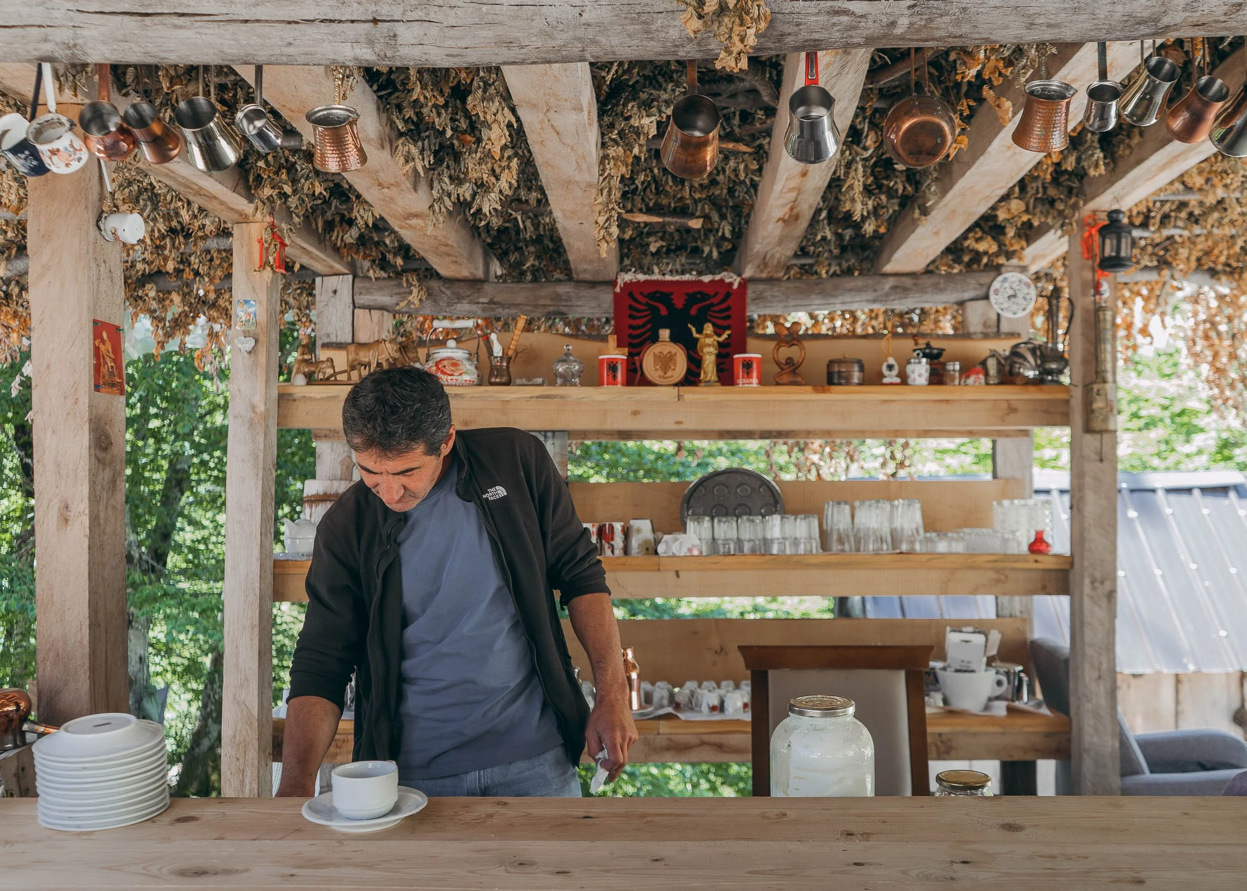 Simoni serving up coffee at his seasonal mountain cafe, Albania