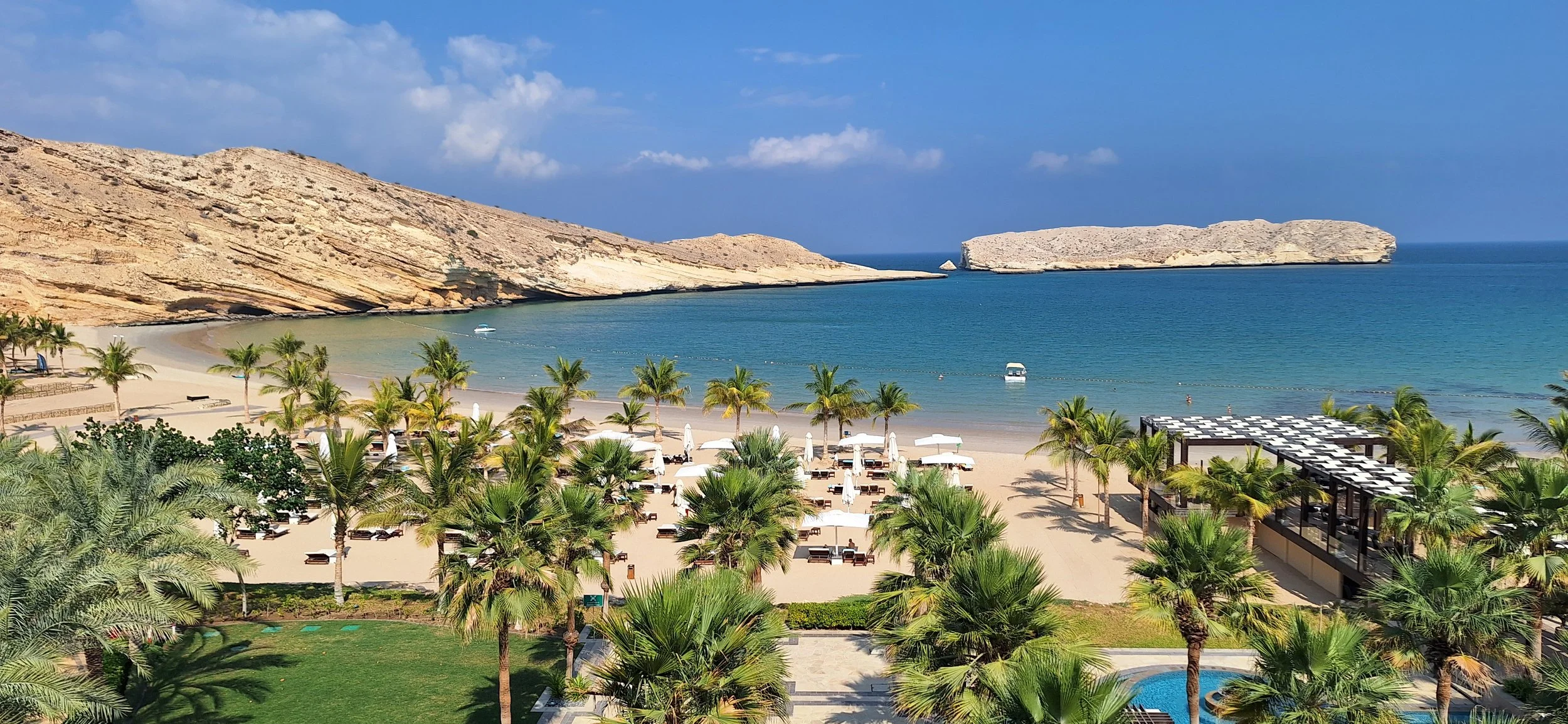 Beach embraces the mountains, Oman