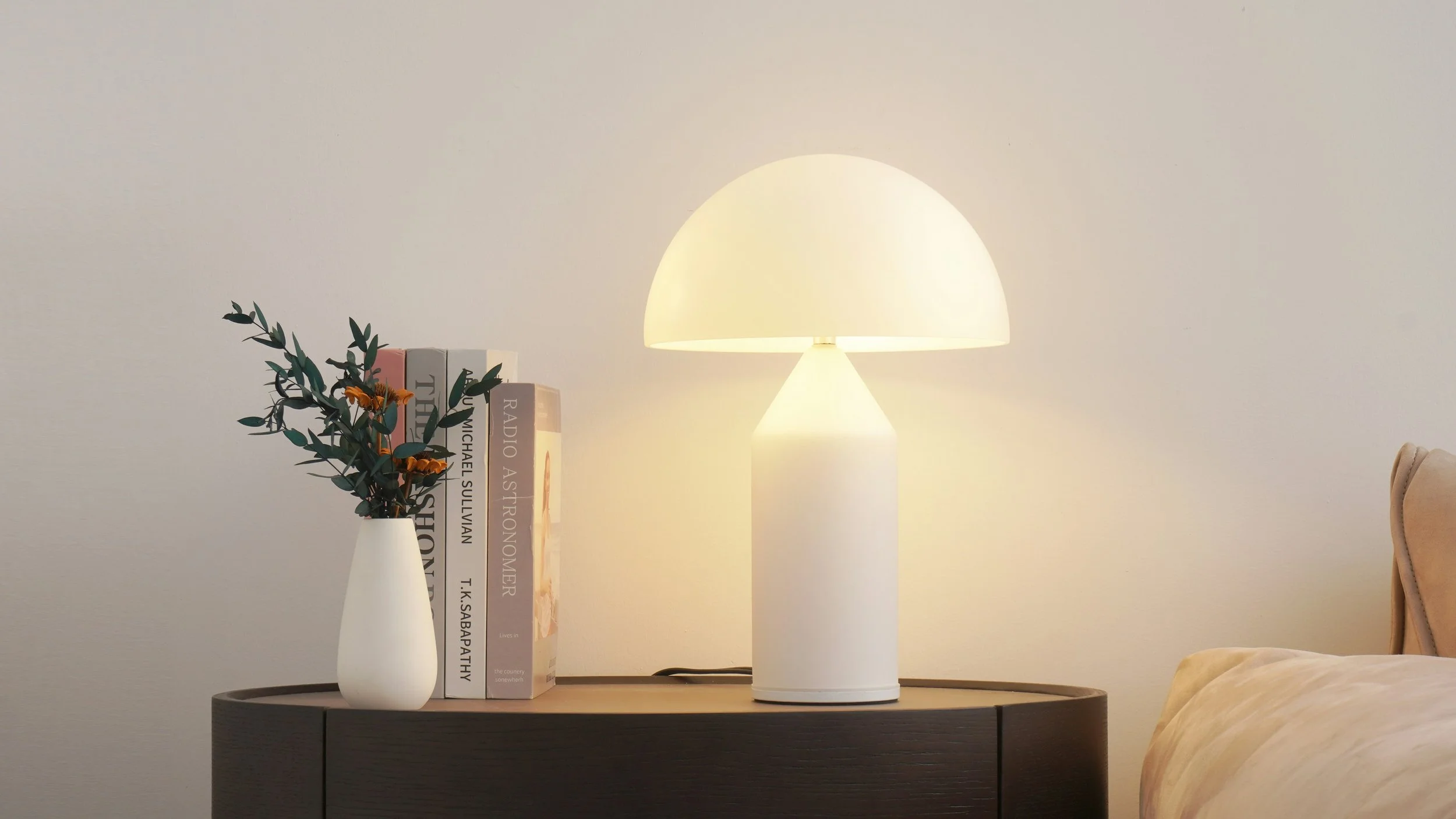 Warm bedside table lamp creating cosy bedroom lighting atmosphere
