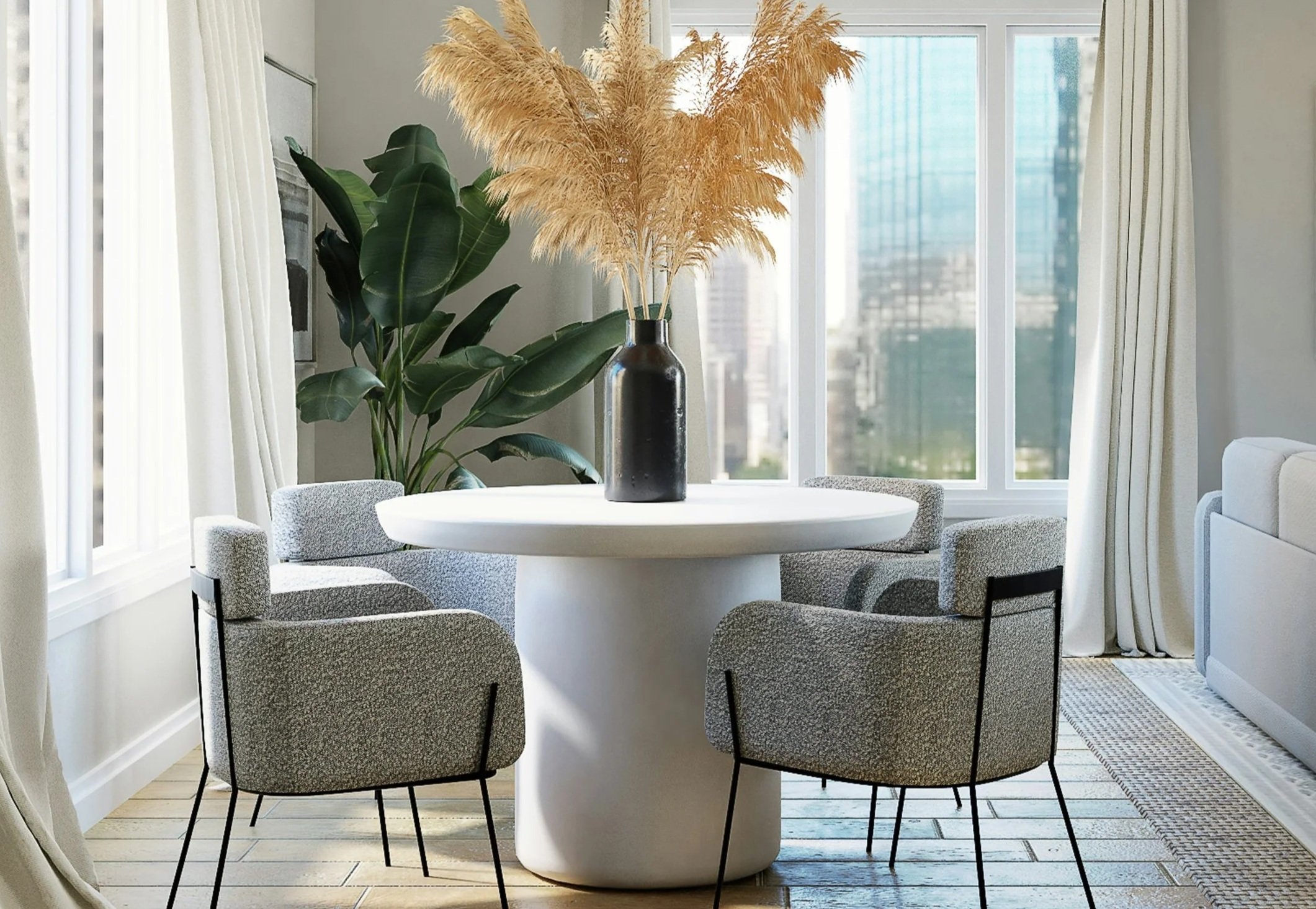 Modern dining room with a concrete round table and large ceramic vase, styled in a minimalist, sustainable interior