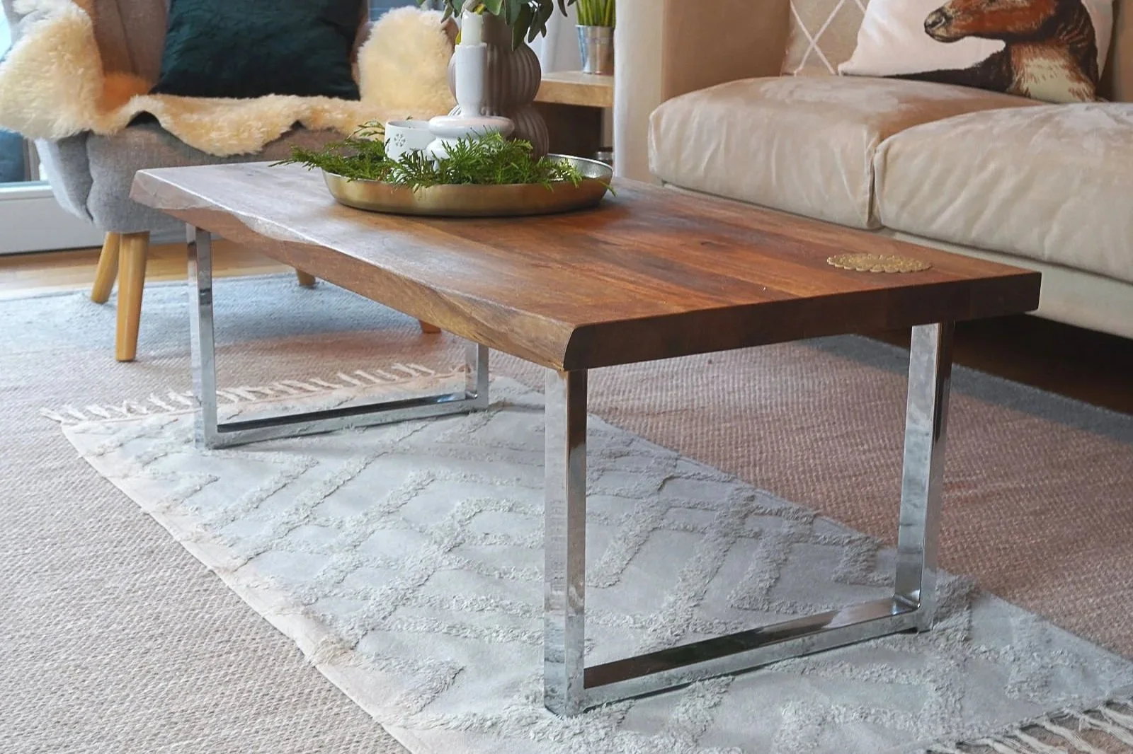Refreshed coffee table with solid mango wood top and uneven edge detail