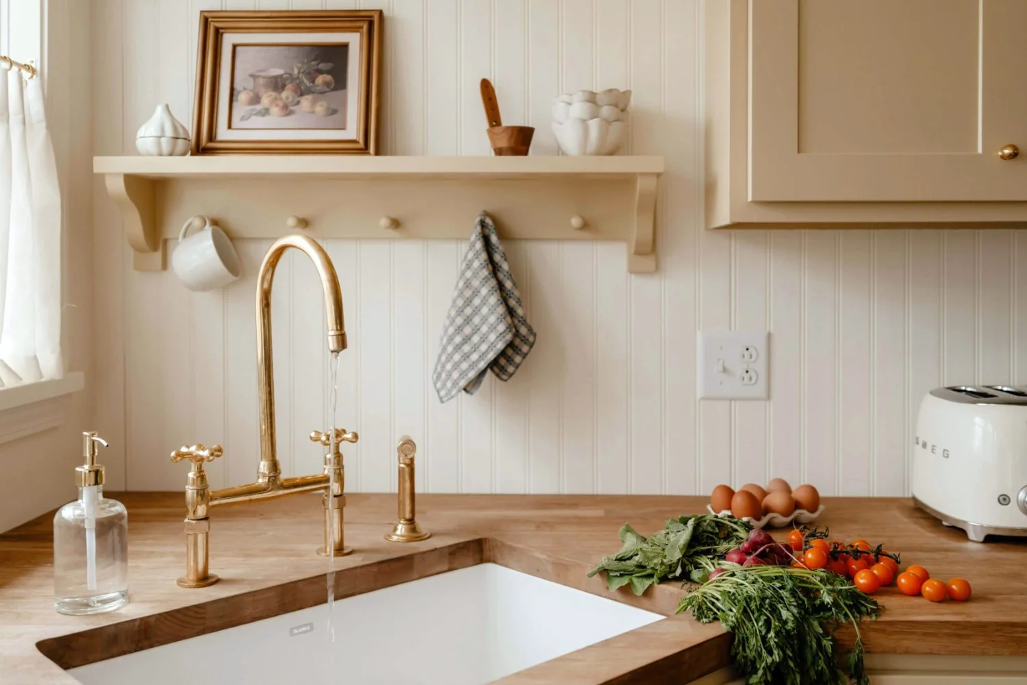 Corner kitchen sink under window with running water and natural ventilation.
