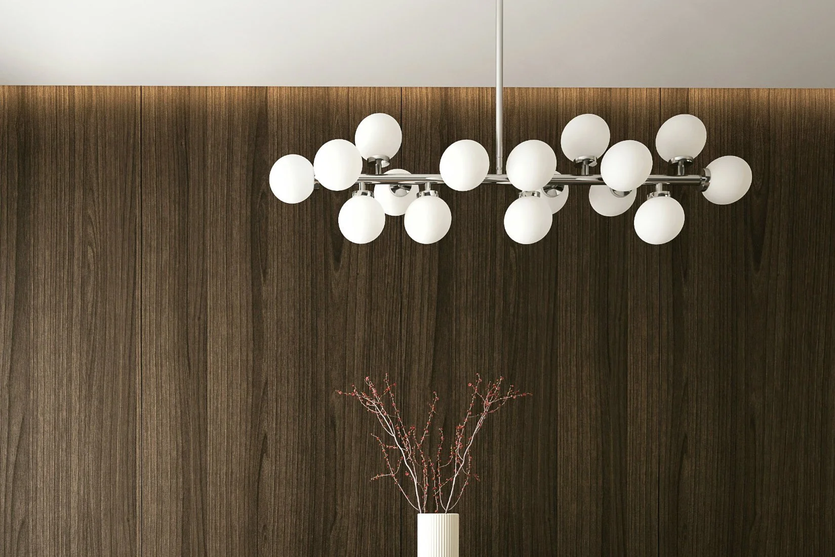 A cluster of spherical glass chandeliers hanging at varying heights, reflecting light like tiny planets in orbit.