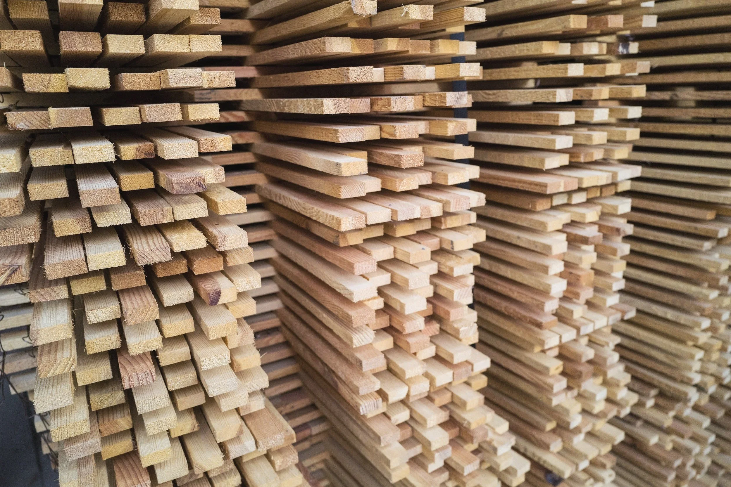 Close-up of timber construction materials, showcasing natural wood textures for sustainable building.