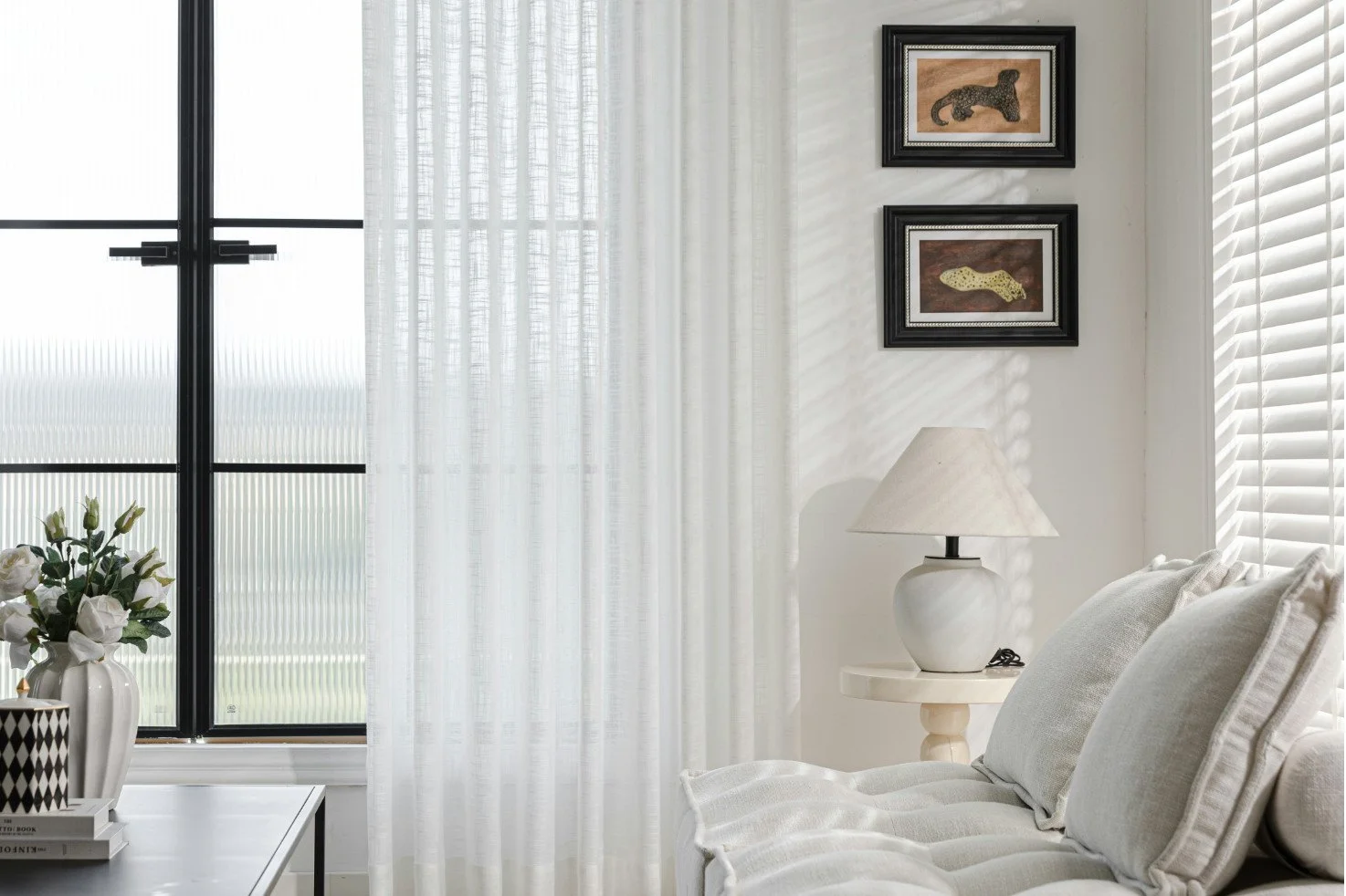 Bright white living room lit by morning sunlight for peace and calm.