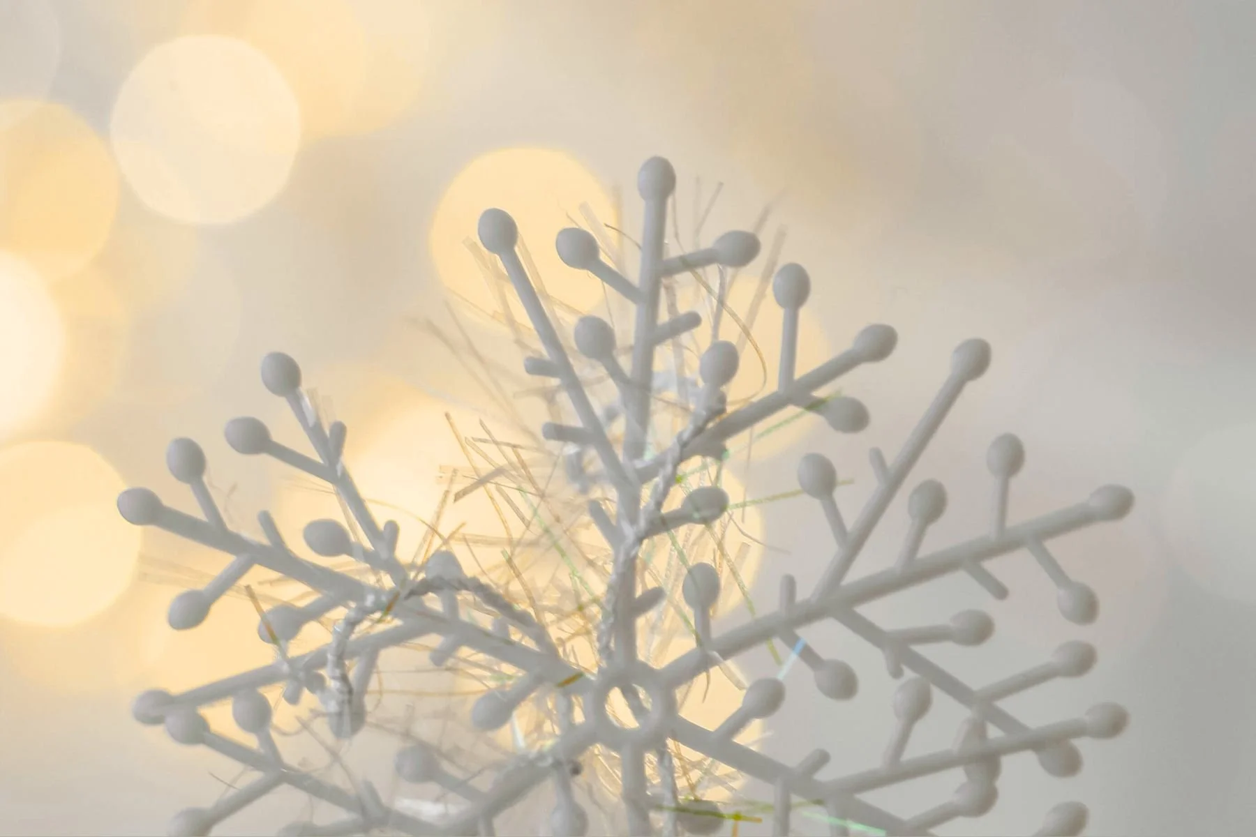 Close-up of Christmas lights showing warm and cool colour temperature differences