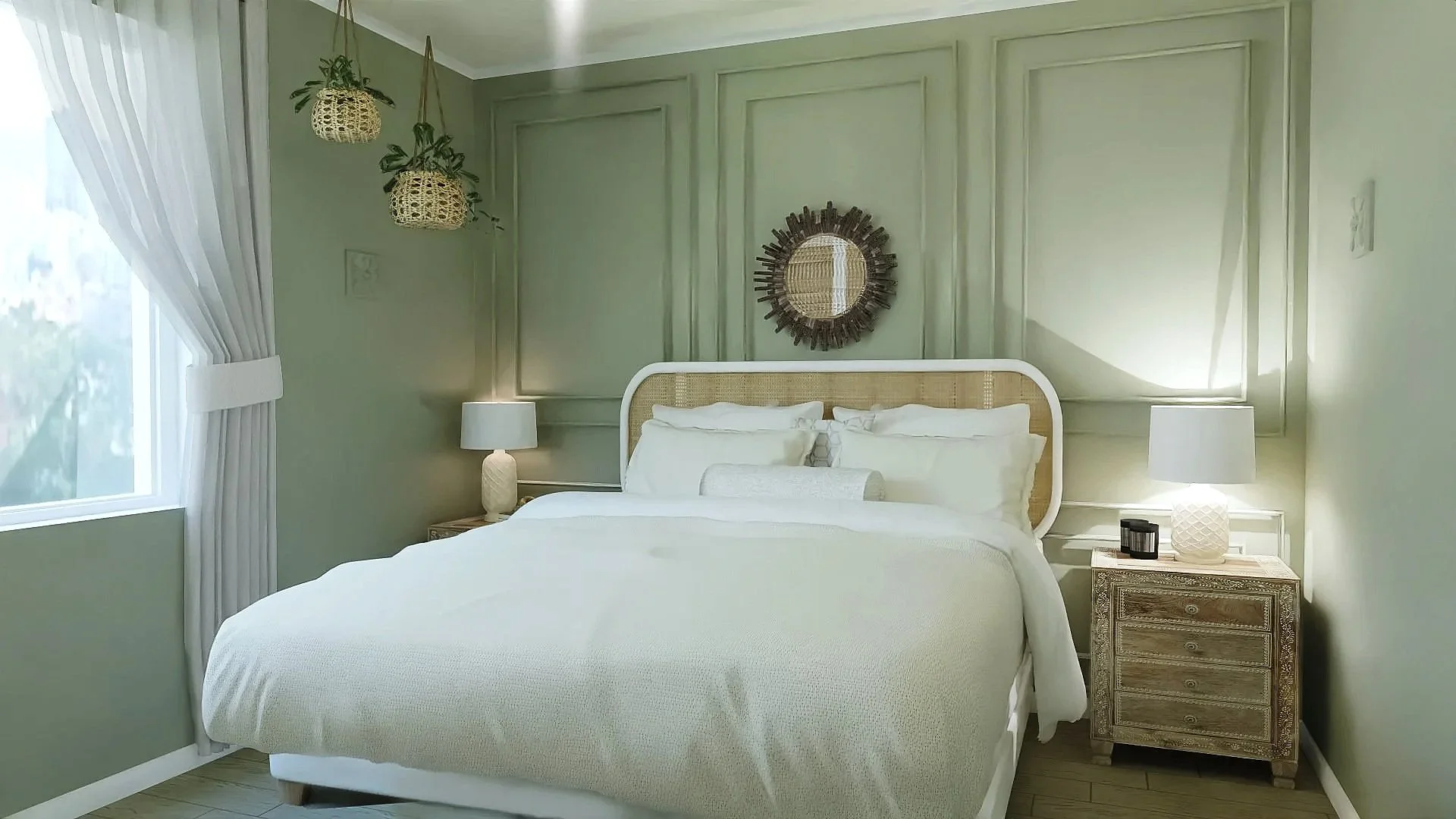 A bedroom with light green walls, a large bed with white bedding, two nightstands with lamps on each side, and hanging plants near a window with white curtains. A round mirror with a dark frame decorates the wall above the headboard.