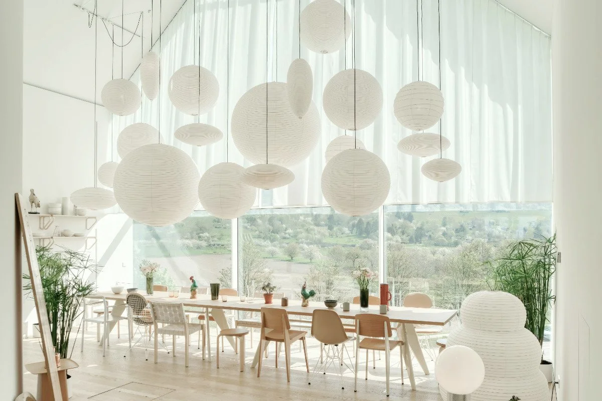 Oversized paper lamps in Japandi style with a soft, diffused glow, evoking a light, cloud-like presence.