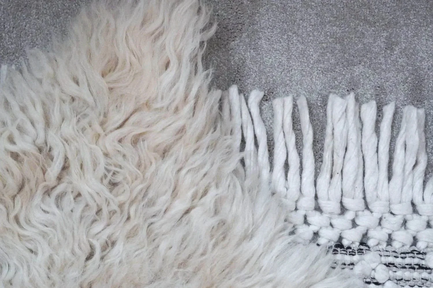 Top down close-up of sheep skin and wool rug for cosy eco-friendly home textiles.