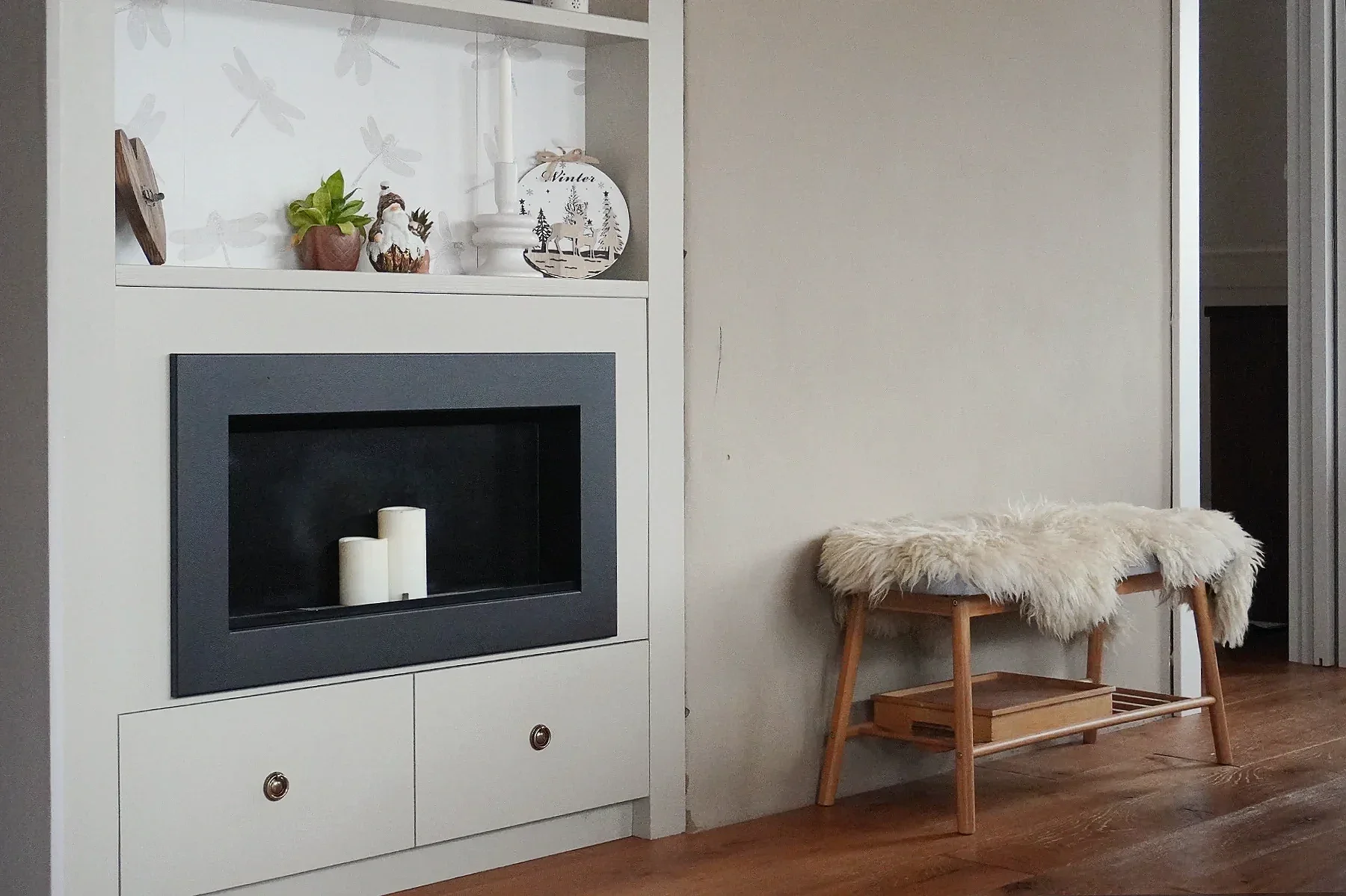 Clay plaster living room wall showing natural marks and signs of family life after ten years