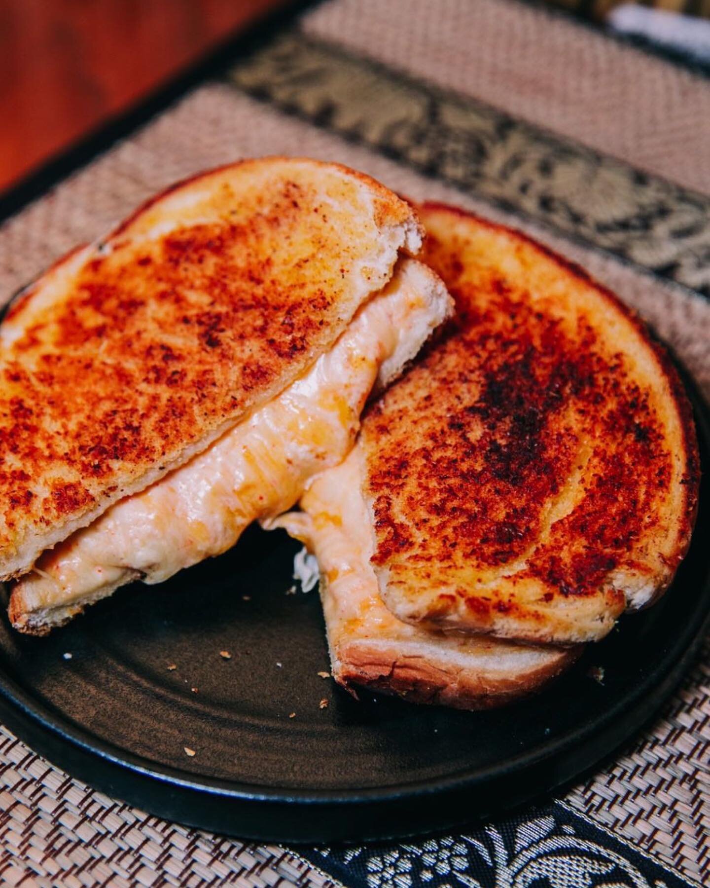 The humble cheese toastie&hellip; done right 👌

Picture this: thick, fluffy cuts of white bloomer bread covered with our secret homemade Thai curry butter. 
Toasted together with a blend of cheddar, mozzarella, Monterey Jack, and cream cheese, resul