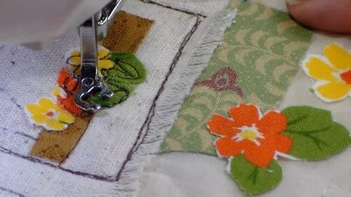 Using brown thread and free-motion the attach the pieces.