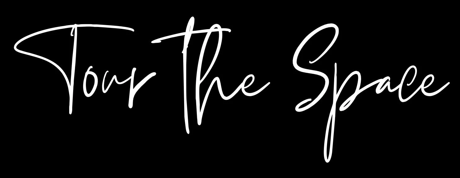 Text saying 'Tour The Space' in white script font on a black background.
